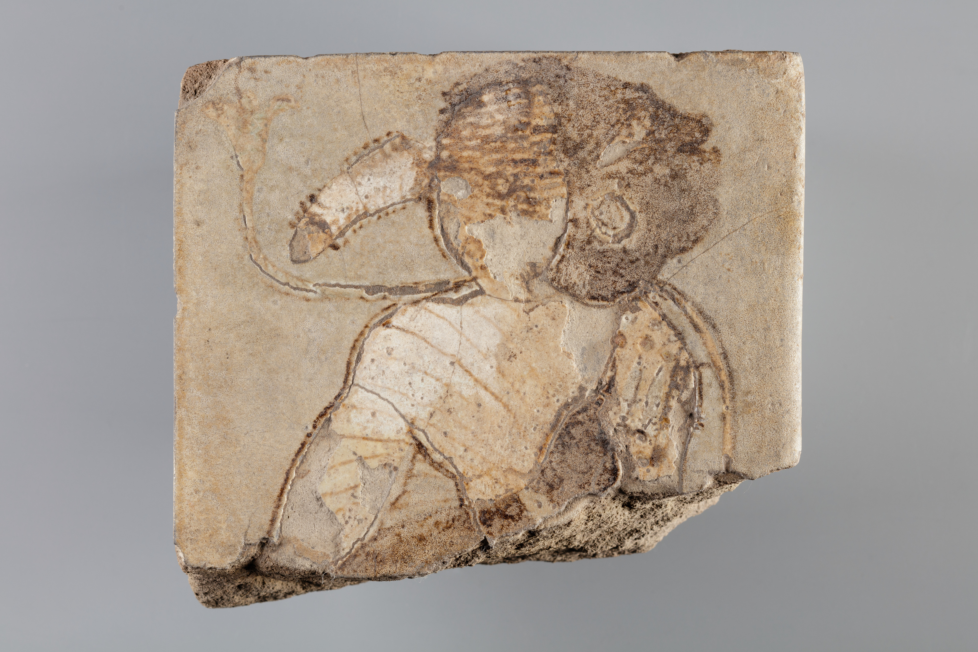 Tile with a bound Nubian from the the side of a dais