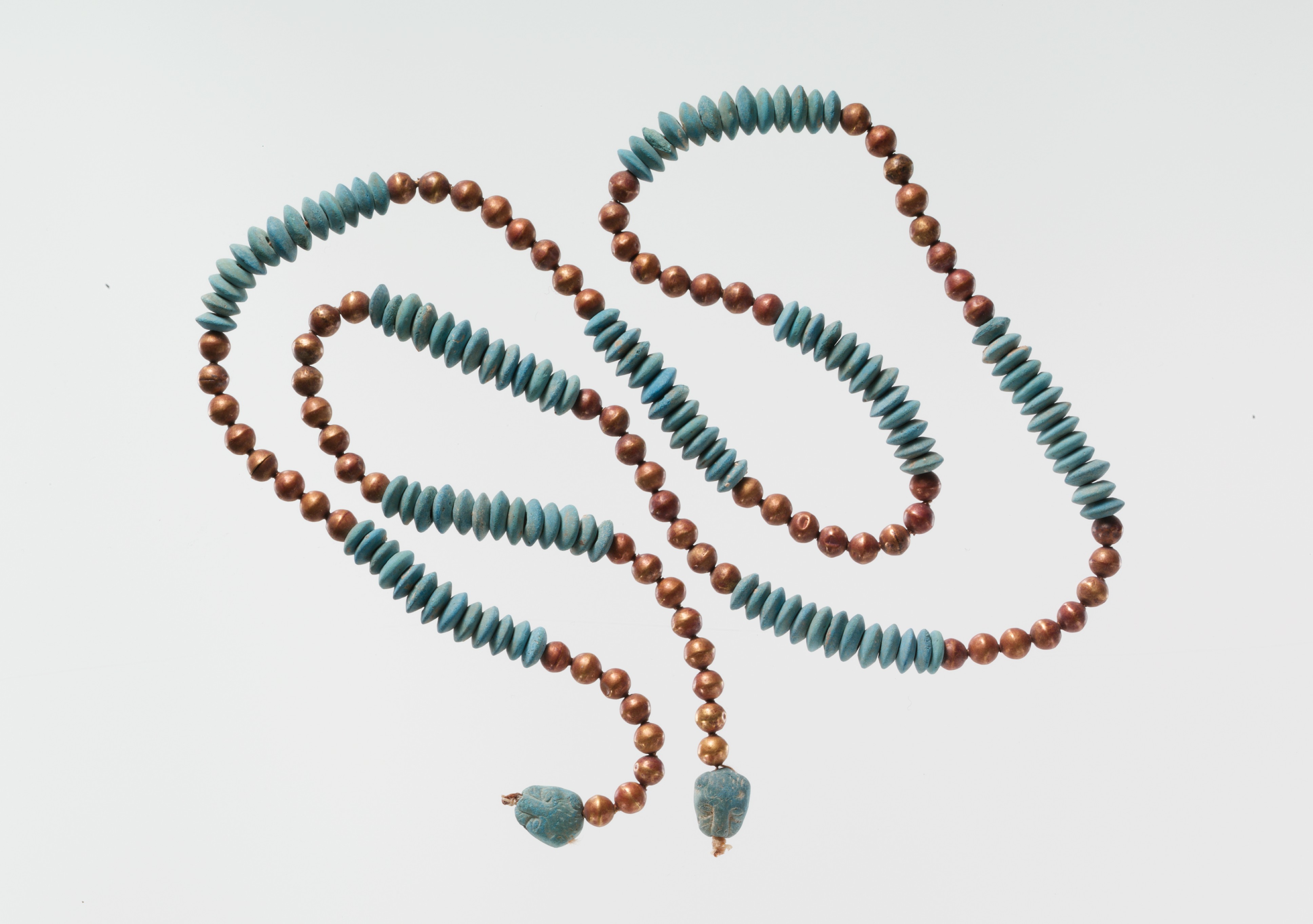 String of Beads with Feline-head Amulets