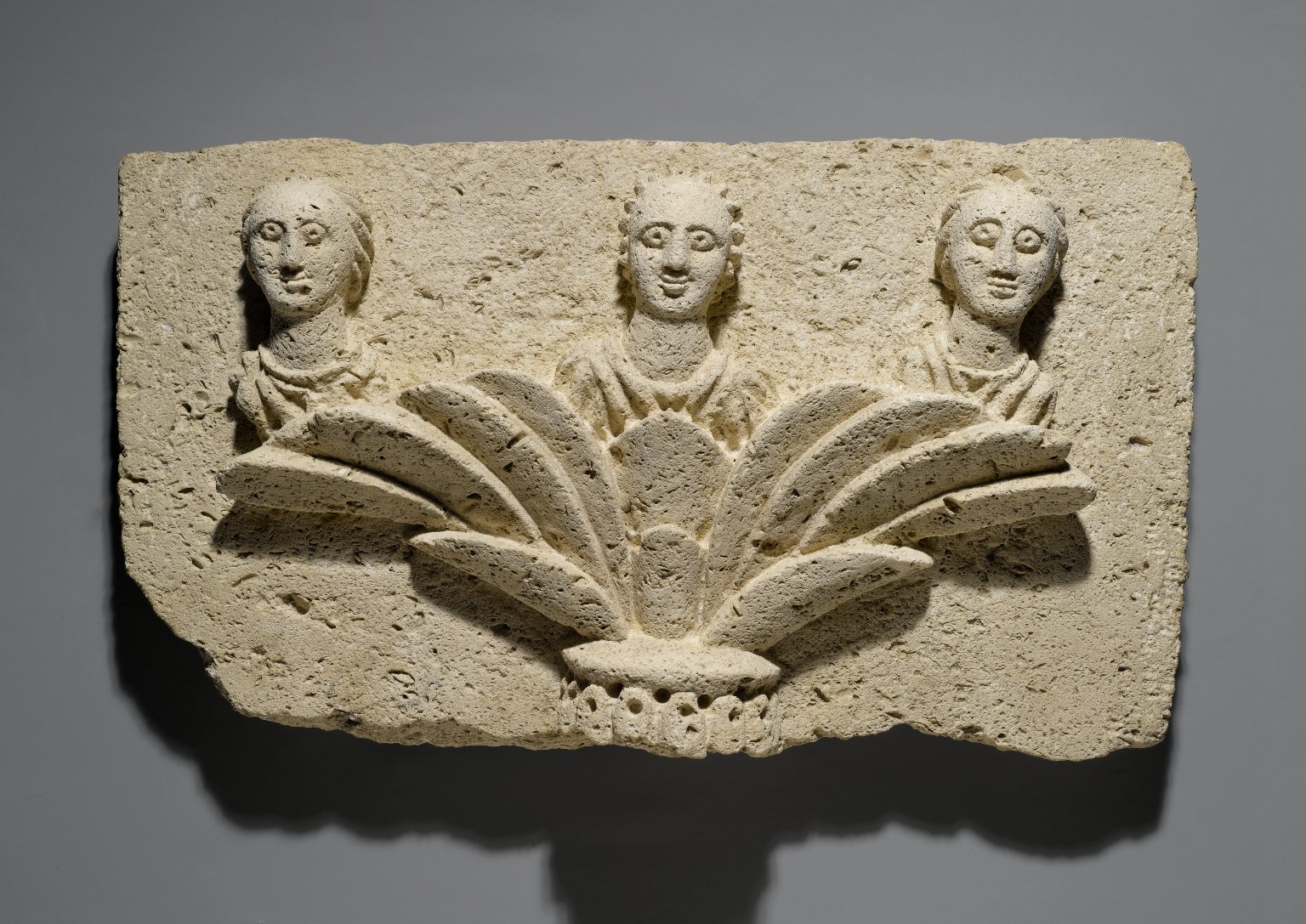 Three Busts on a Capital