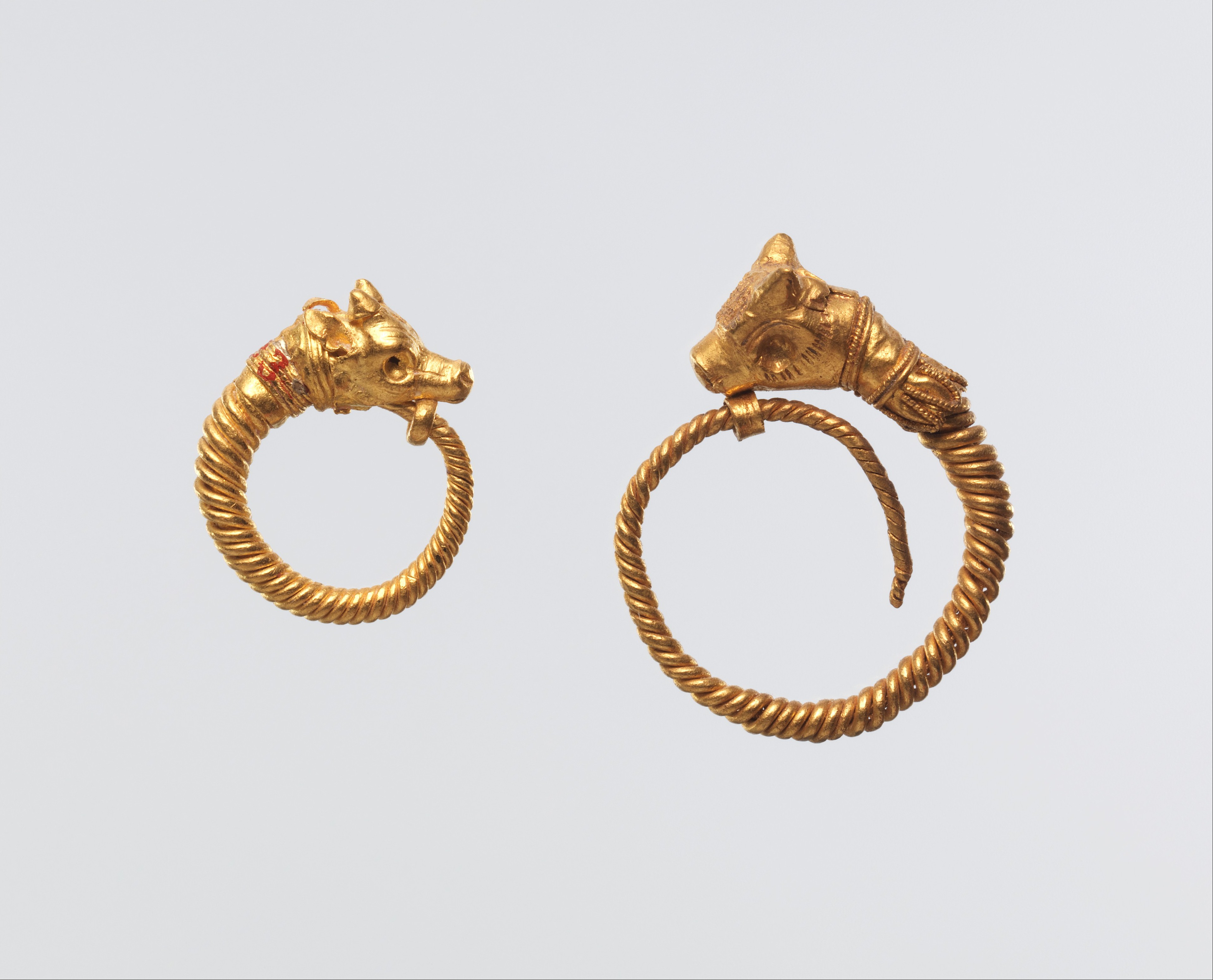 Earring with bull head terminal