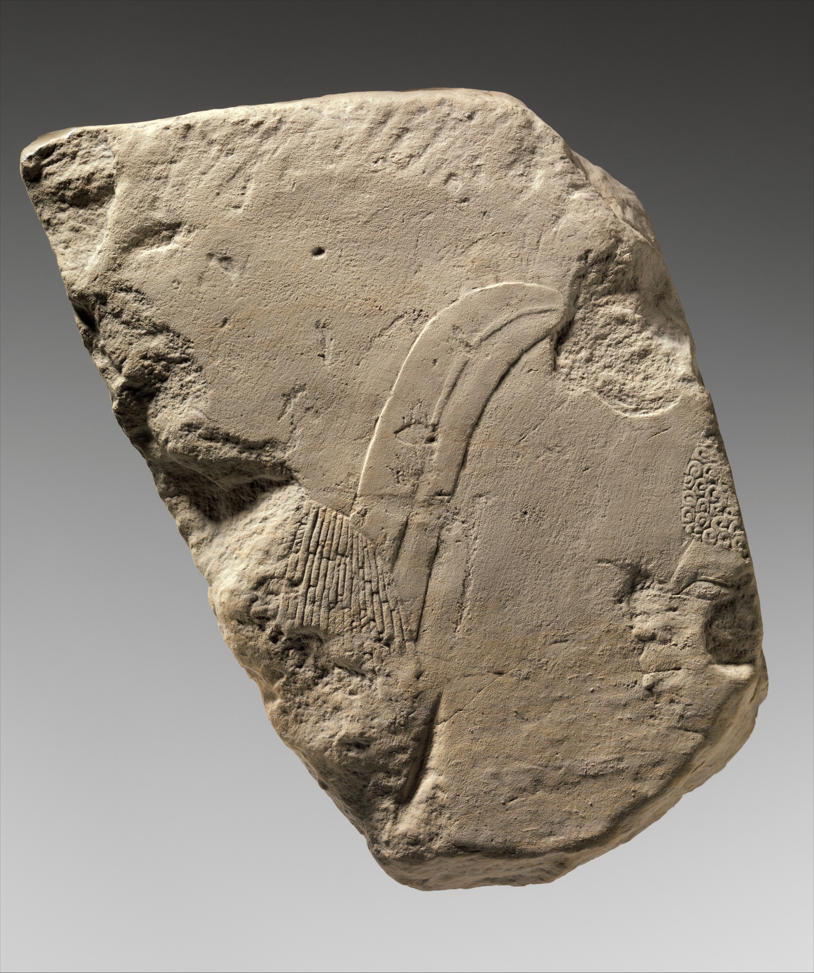 Relief fragment: foreigner with feather in his hair and Nubian