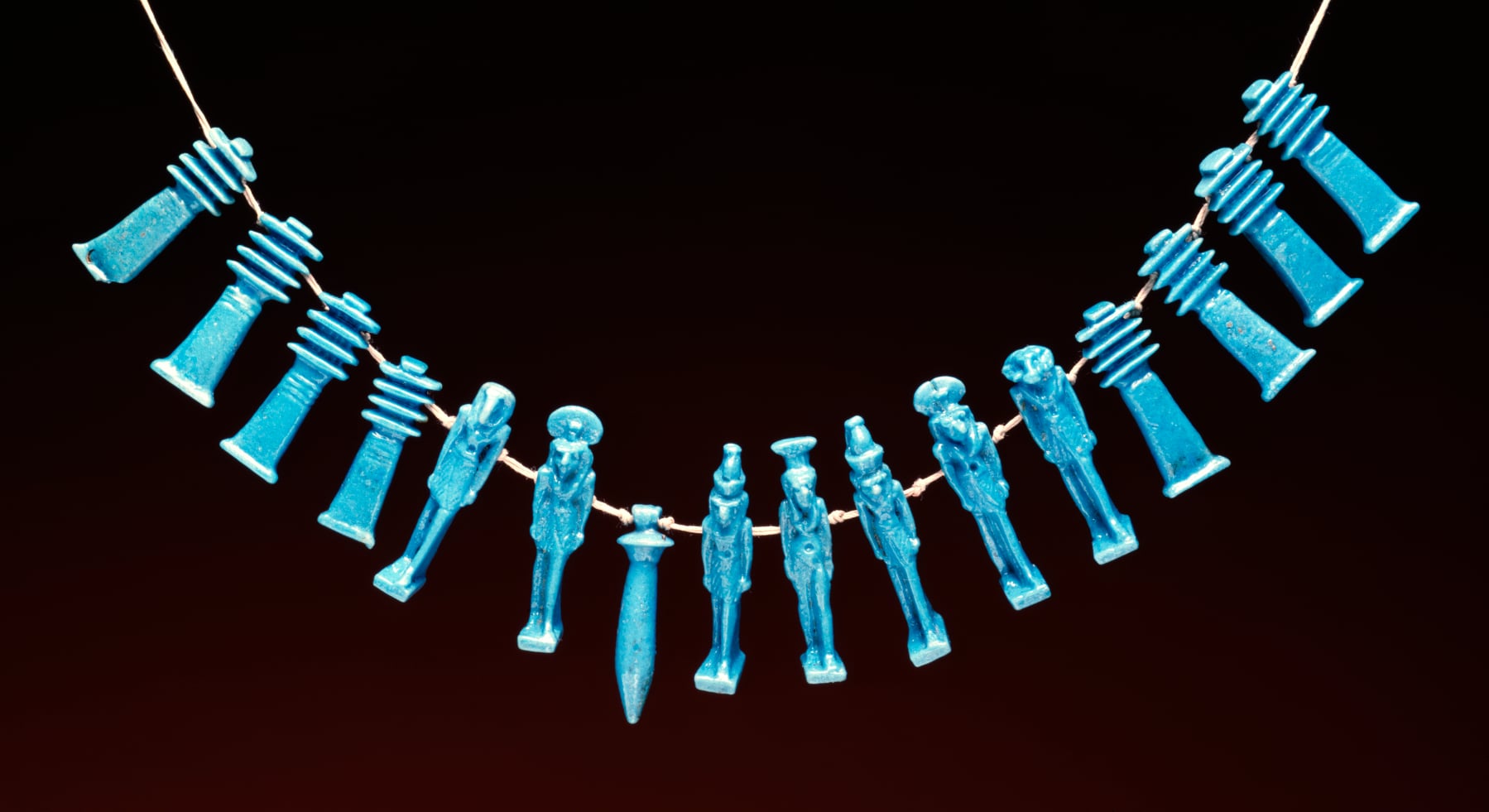 Group of 16 Amulets Strung as a Necklace