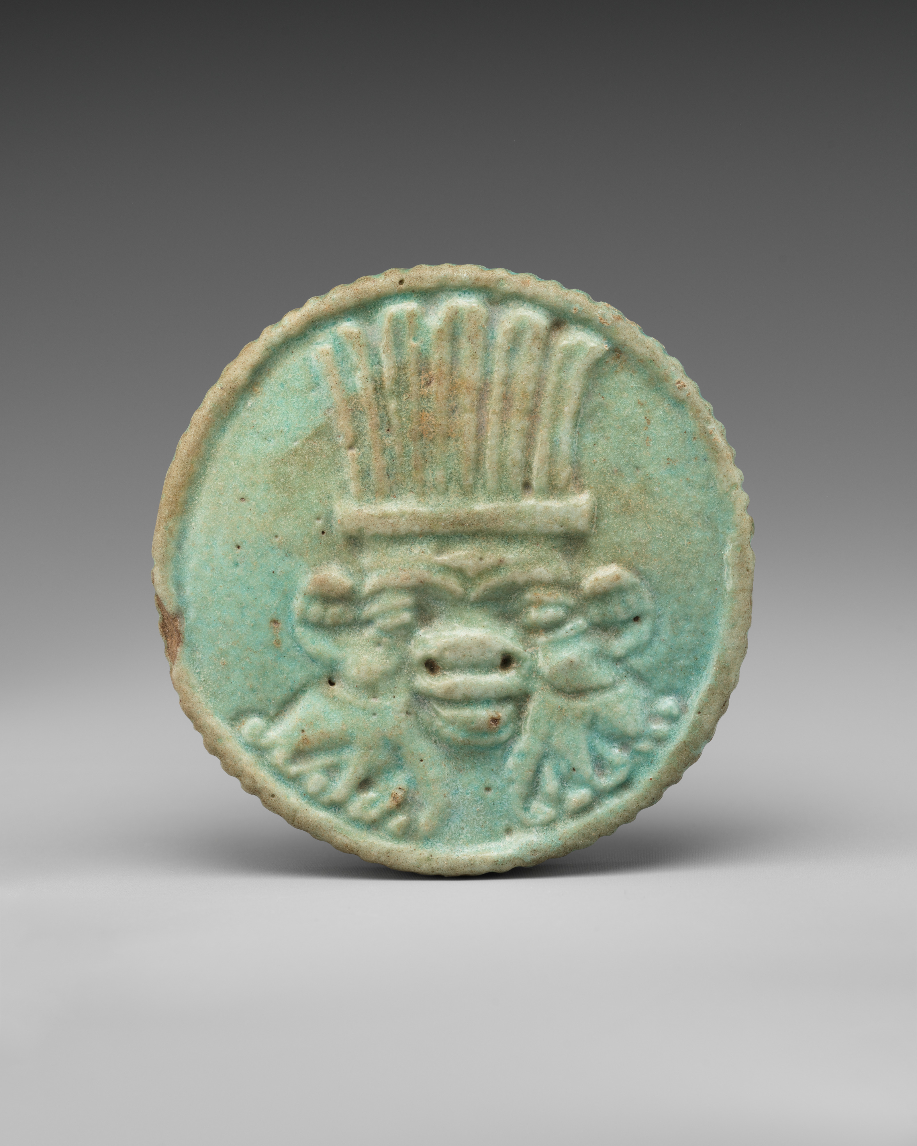 Head of Bes and Sacred eye Amulet
