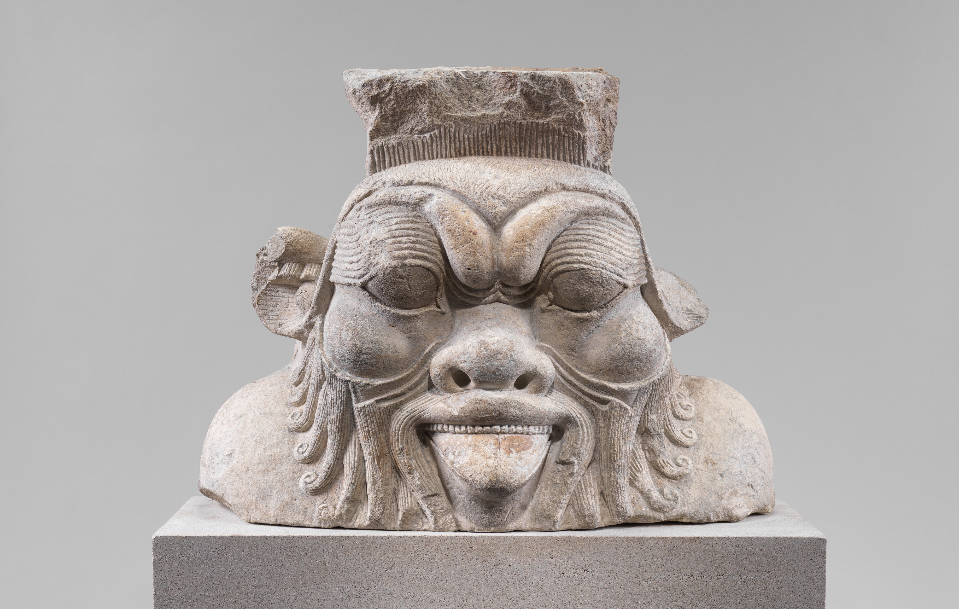 Colossal head from a Bes-image