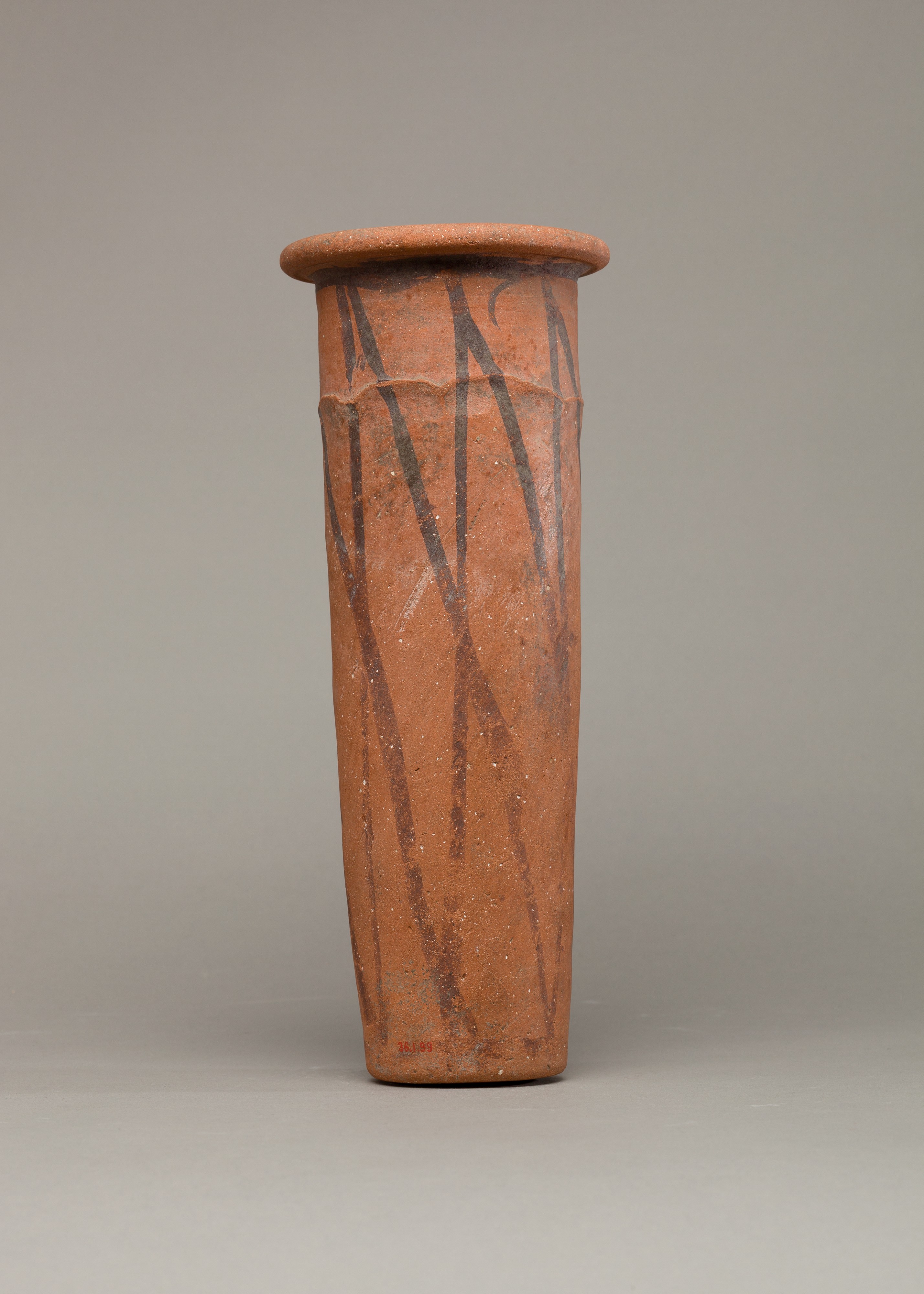 Wavy-handled jar with cross-hatched design