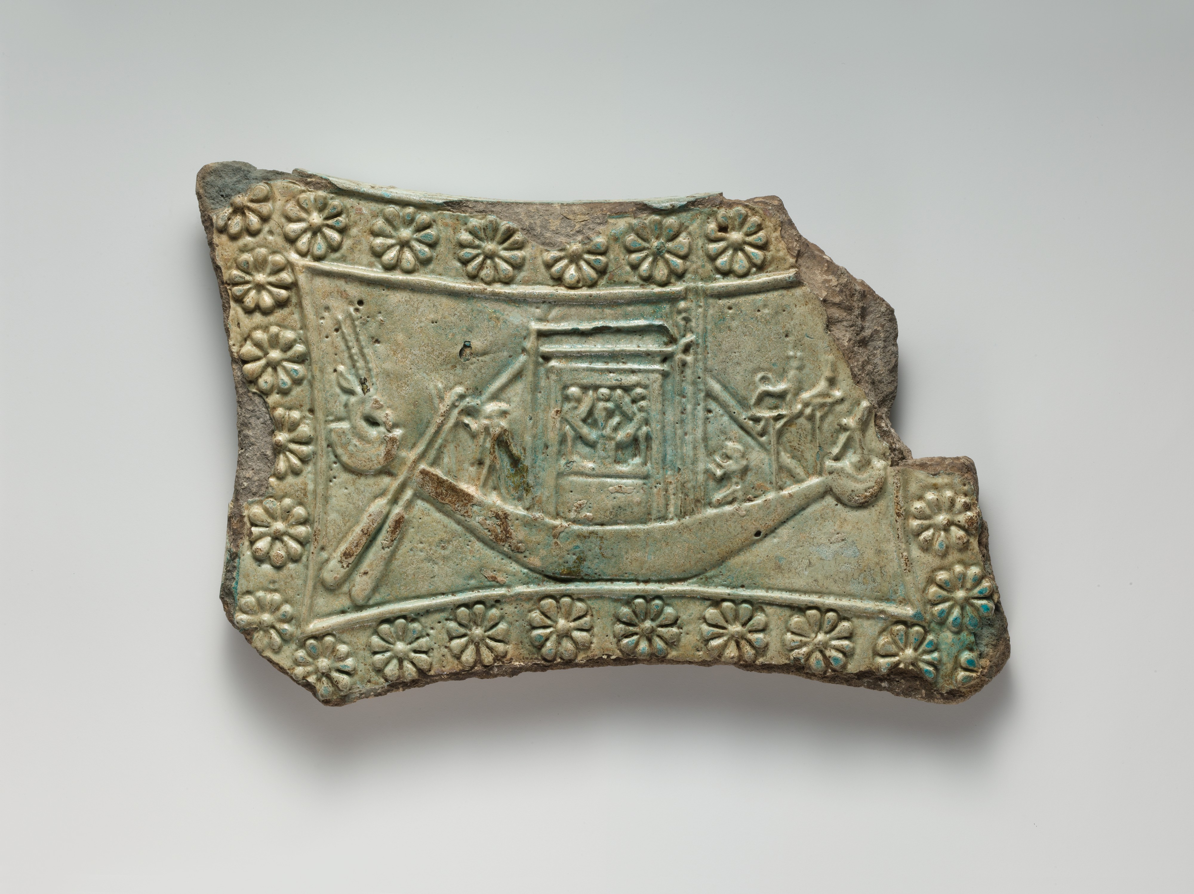 Model tambourine with rosette border, Bastet on one side, her boat with naos on the other