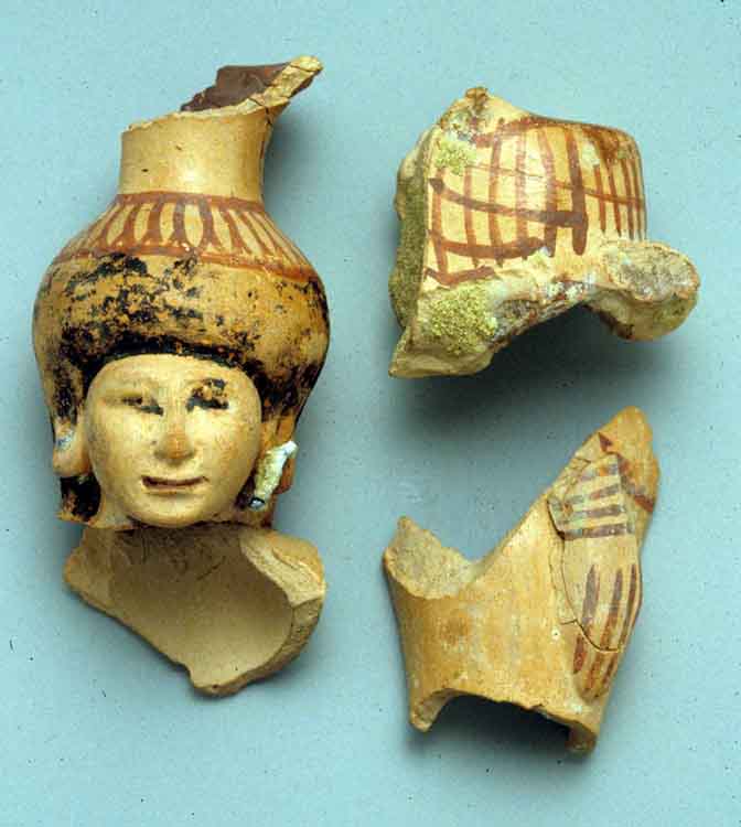 Fragments of a vase in the form of a woman holding a basket