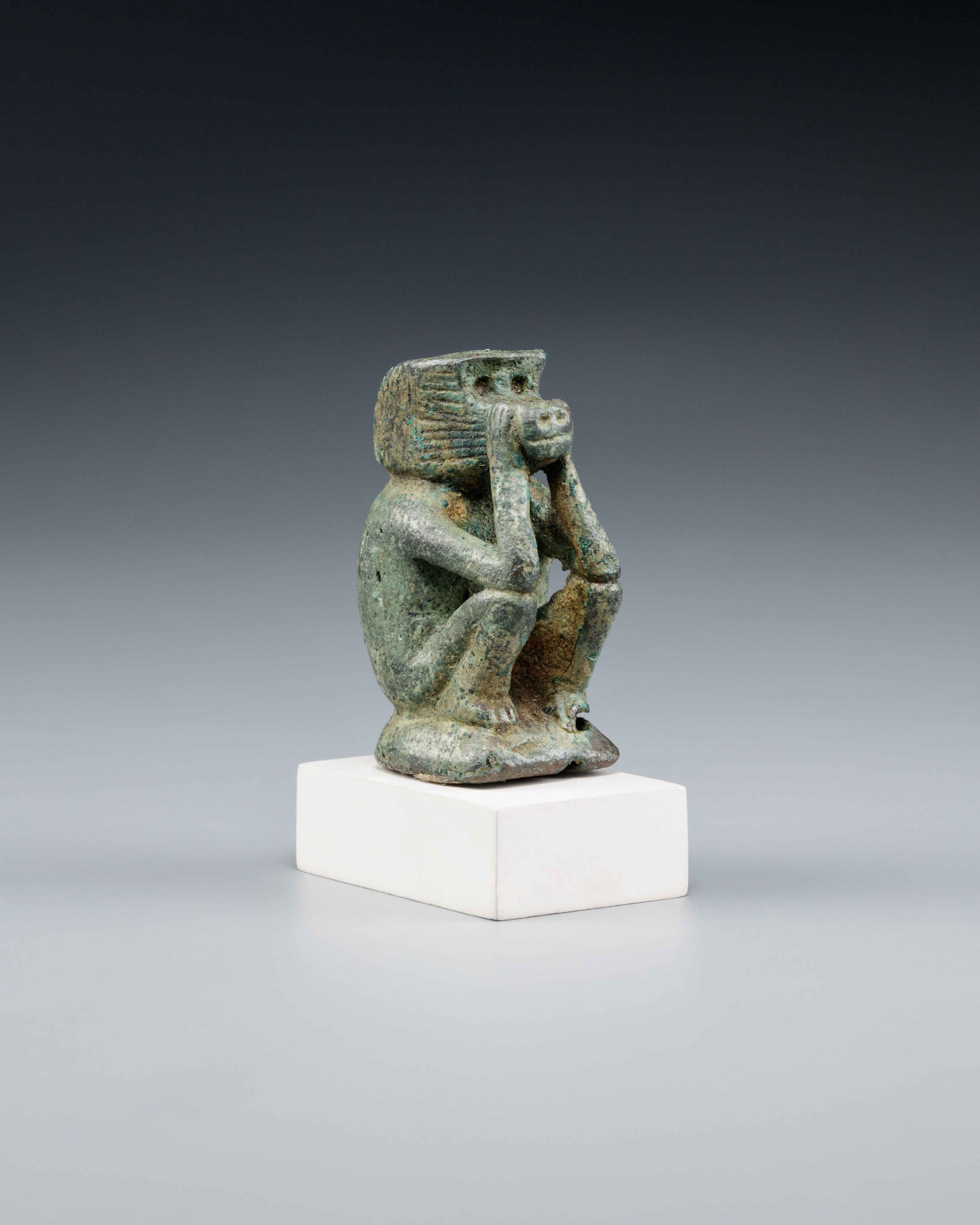 Figure of a squatting cynocephalus ape