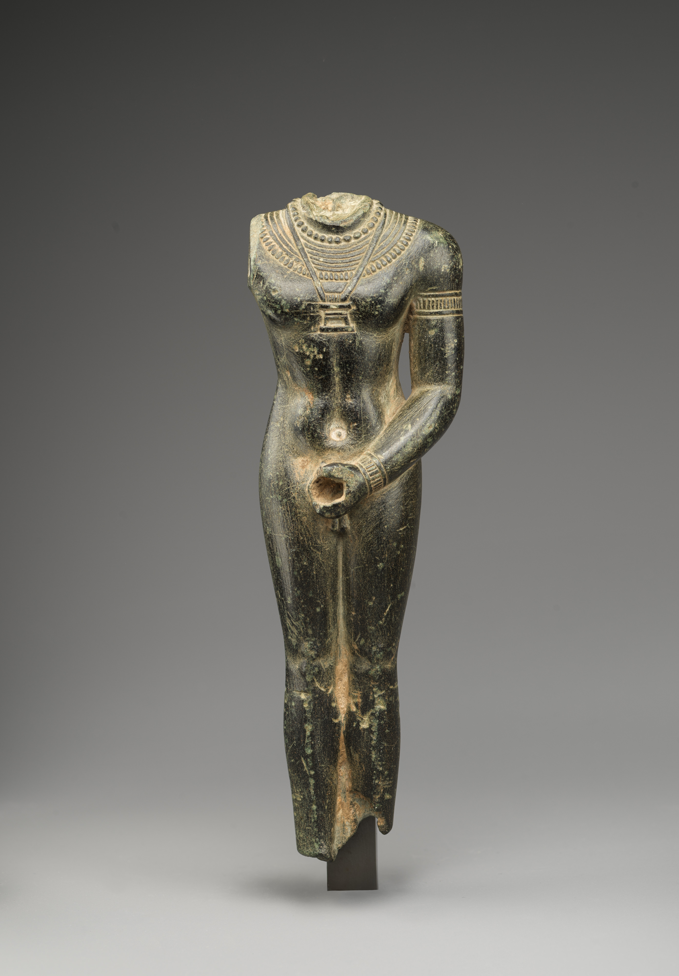 Headless unshrouded ithyphallic deity statuette