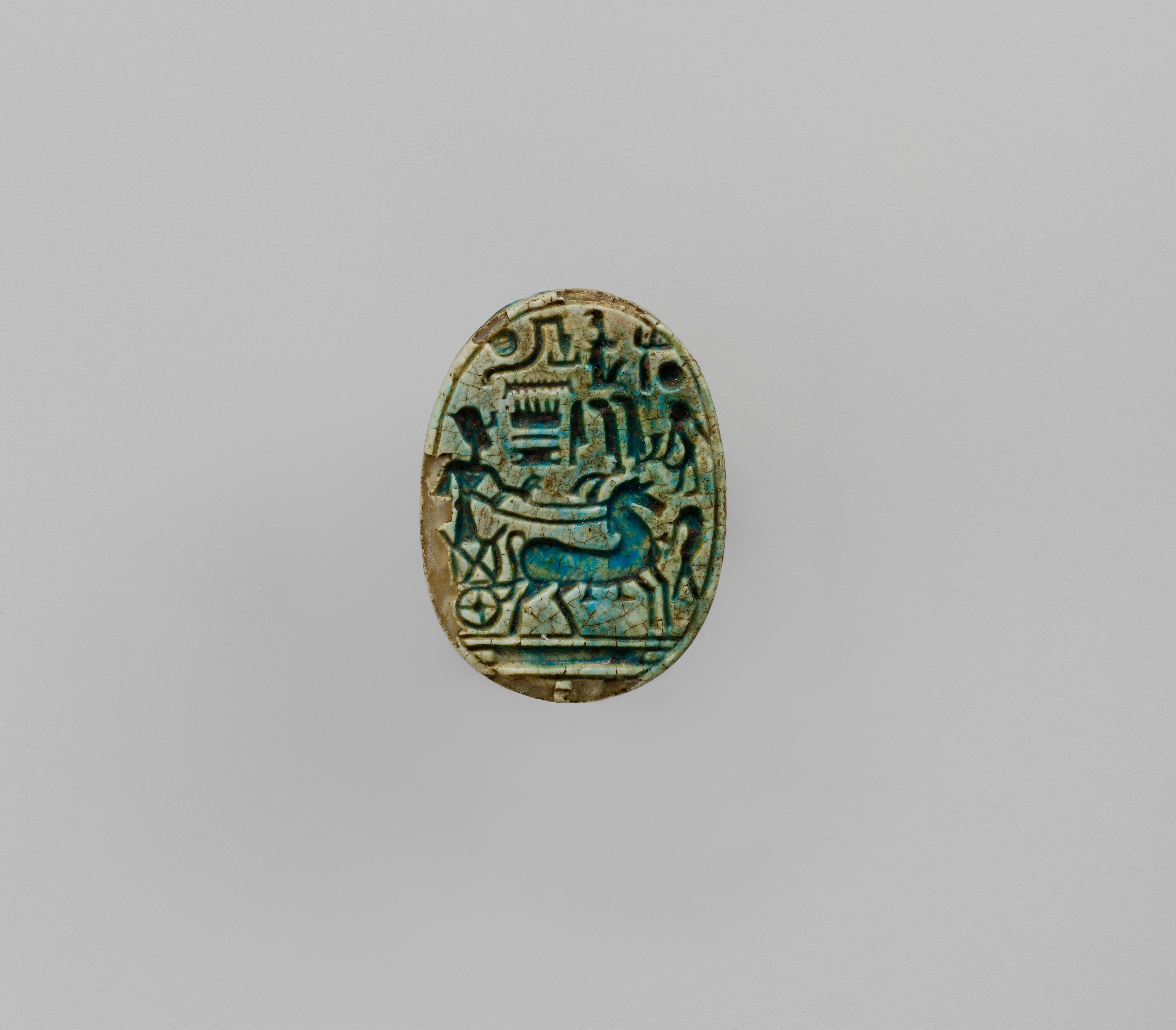 Scarab Inscribed With the Prenomen of Ramesses II and depicting the king in his chariot trampling an enemy