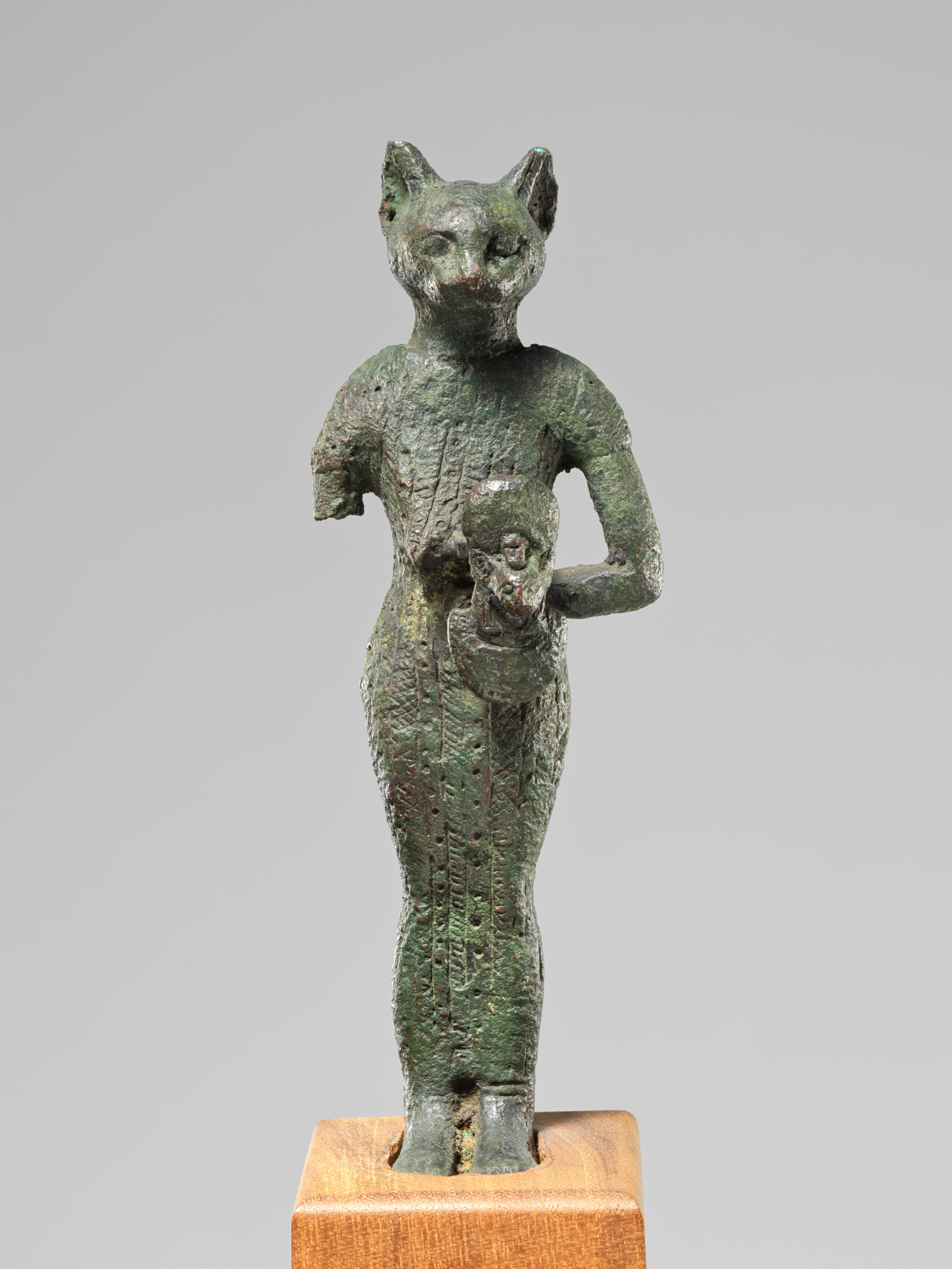 Bastet holding aegis and basket