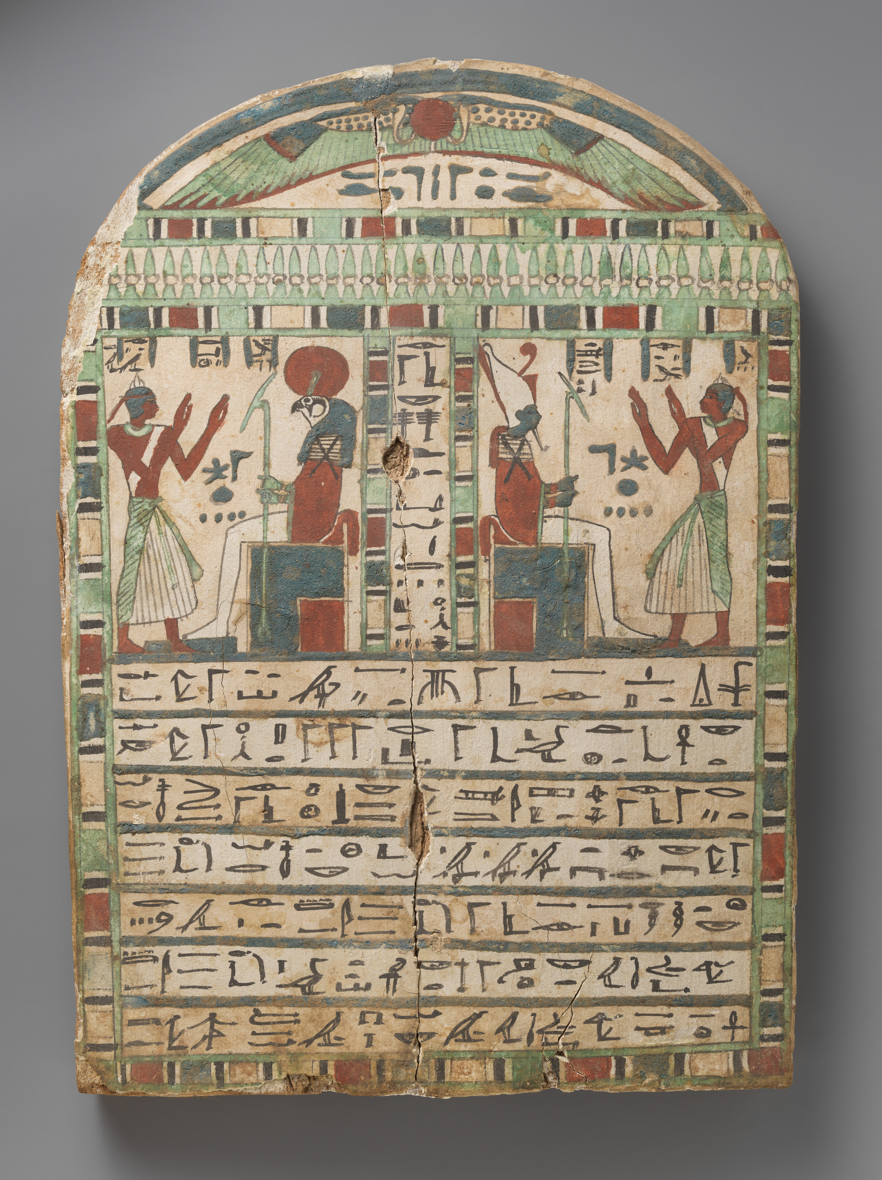 Stela of the temple servant of Amun Irtihareru adoring Re-Harakhty and Atum