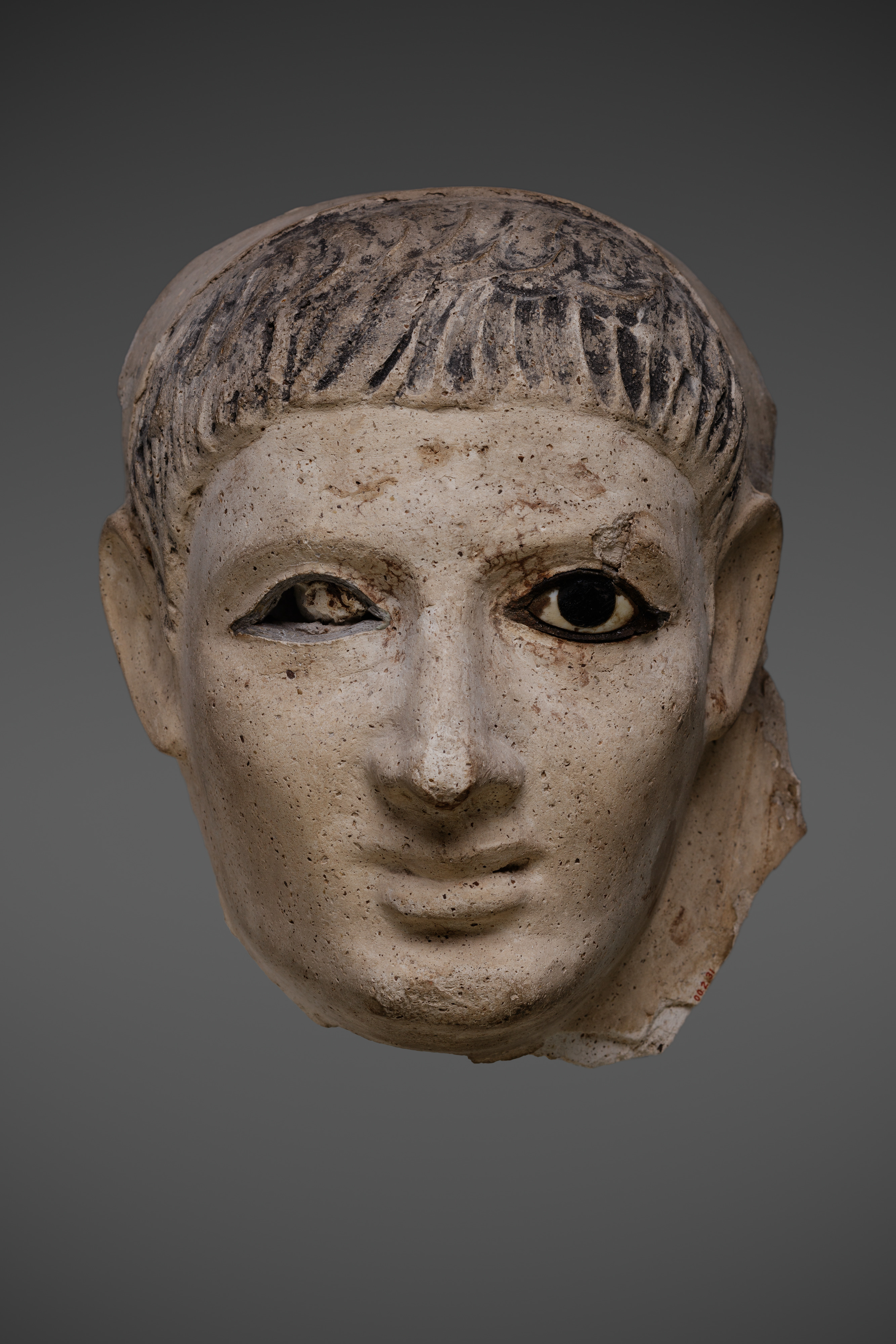 Mask of a man who wore a striped headcloth