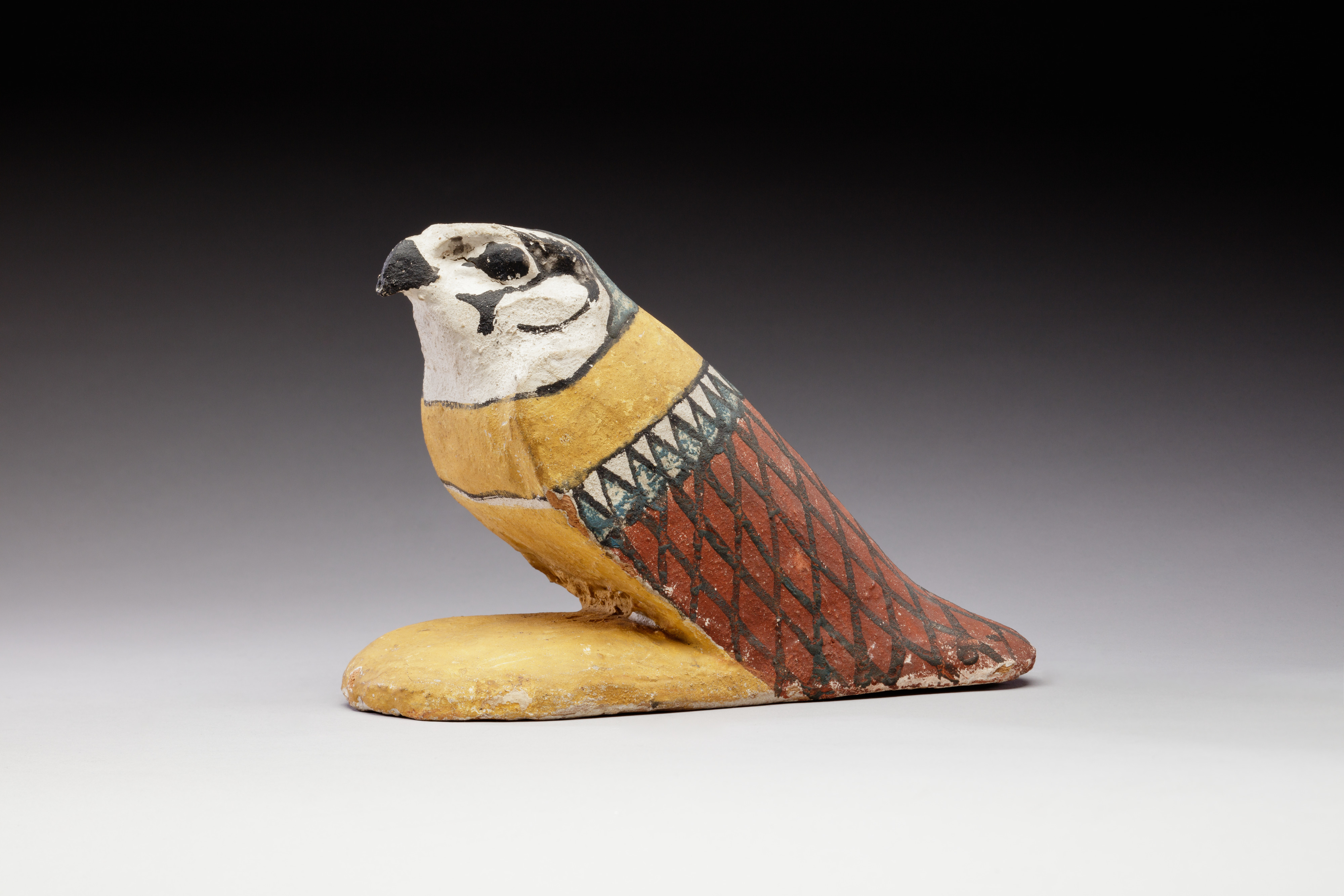 Falcon figurine from a coffin or box