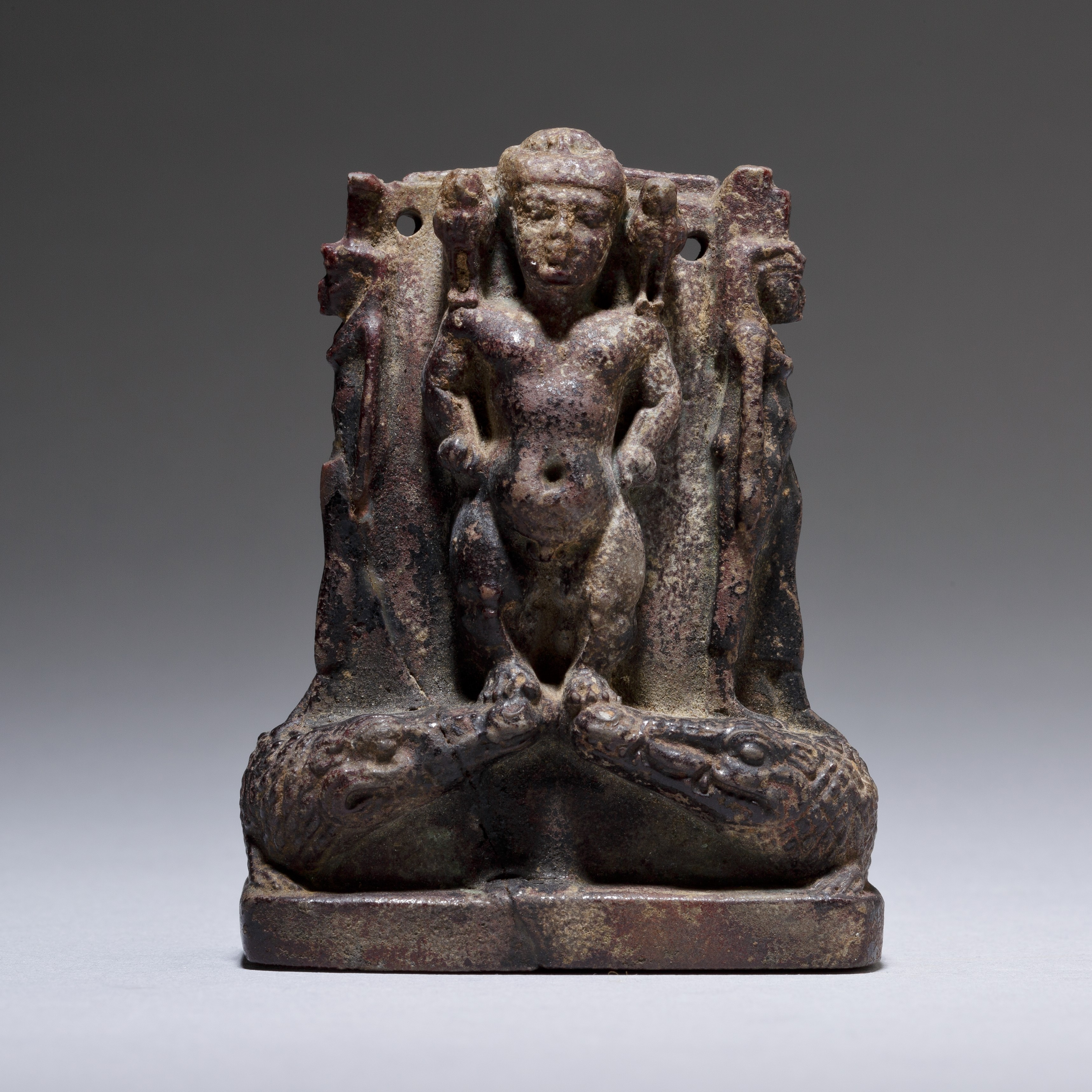Cippus (magical stela) where Pataikos replaces Horus on the crocodiles and is flanked by Isis and Nephthys