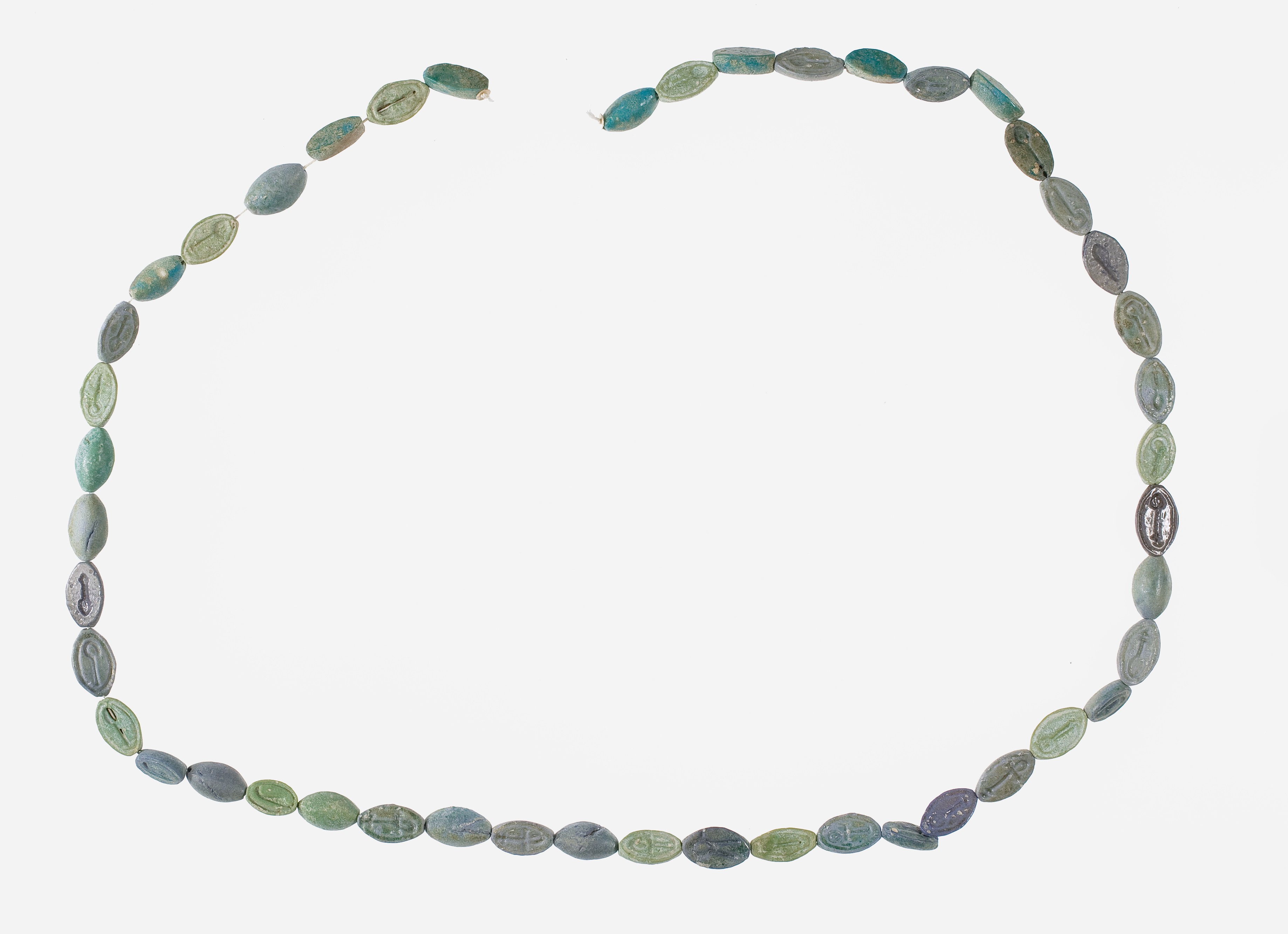 String of 46 Cowroids Inscribed with Various Hieroglyphs