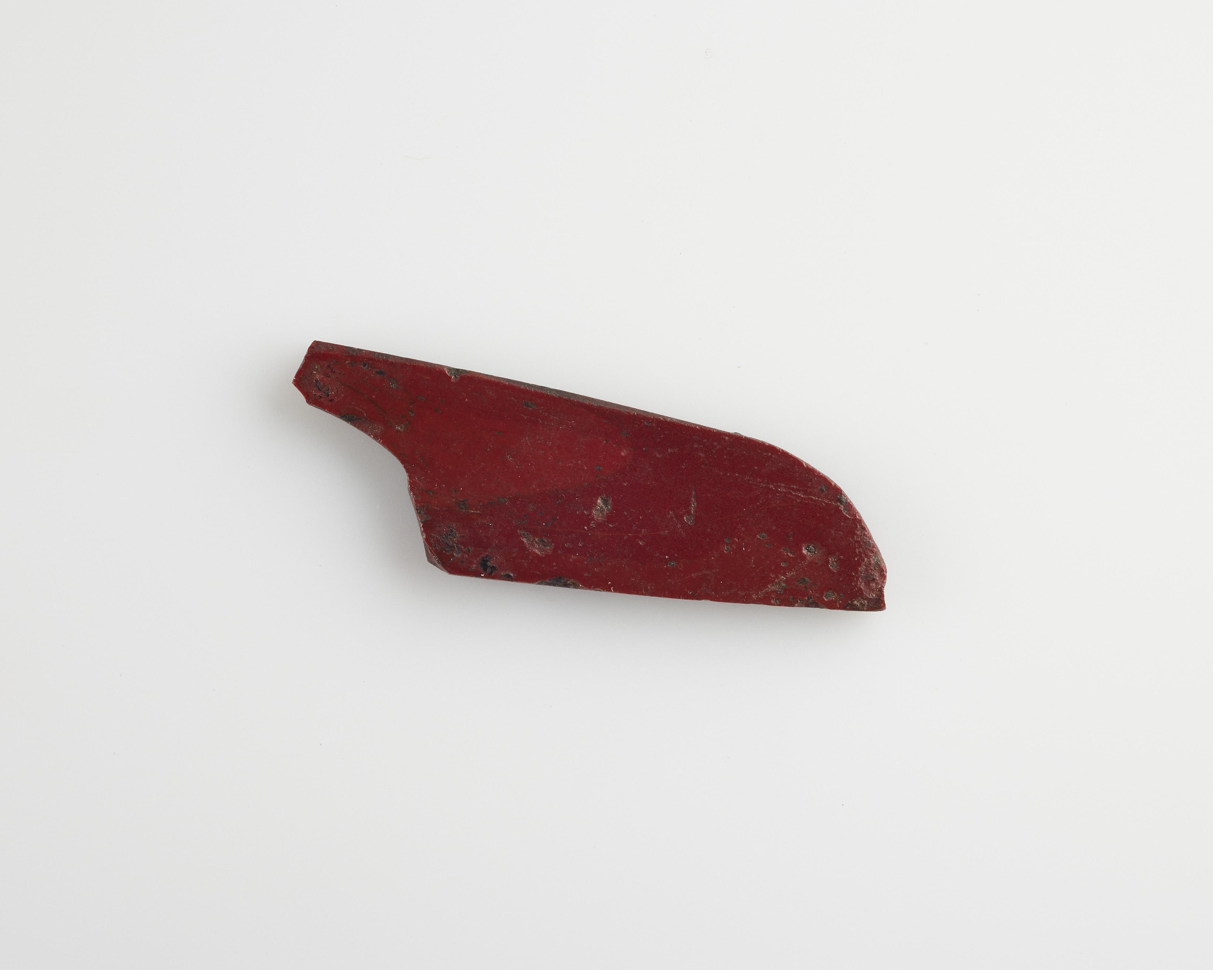 Part of an inlay: a wing form. Cut with a die