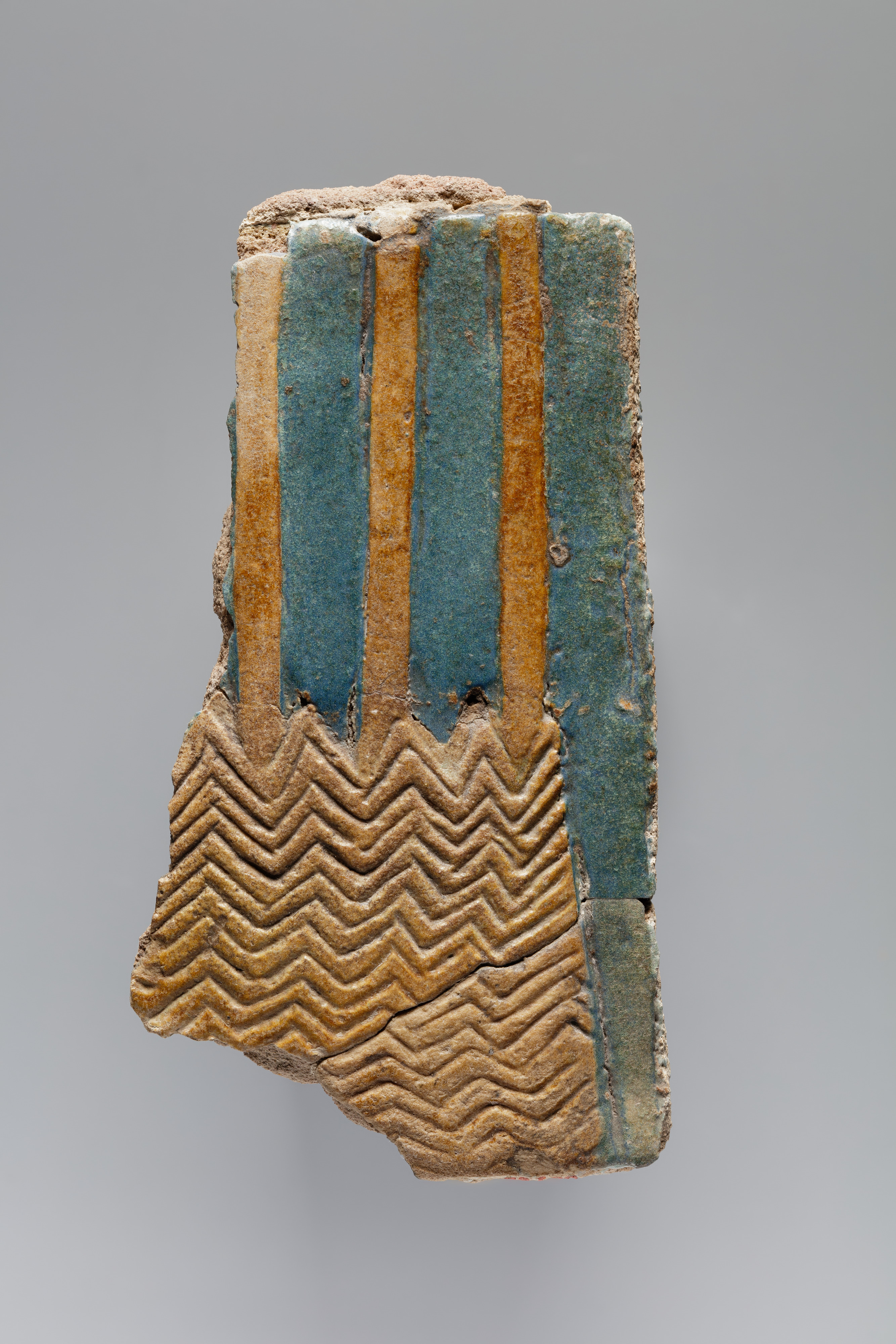 Tile fragment of clumps of sedge and papyrus plants from the palace of Ramesses II