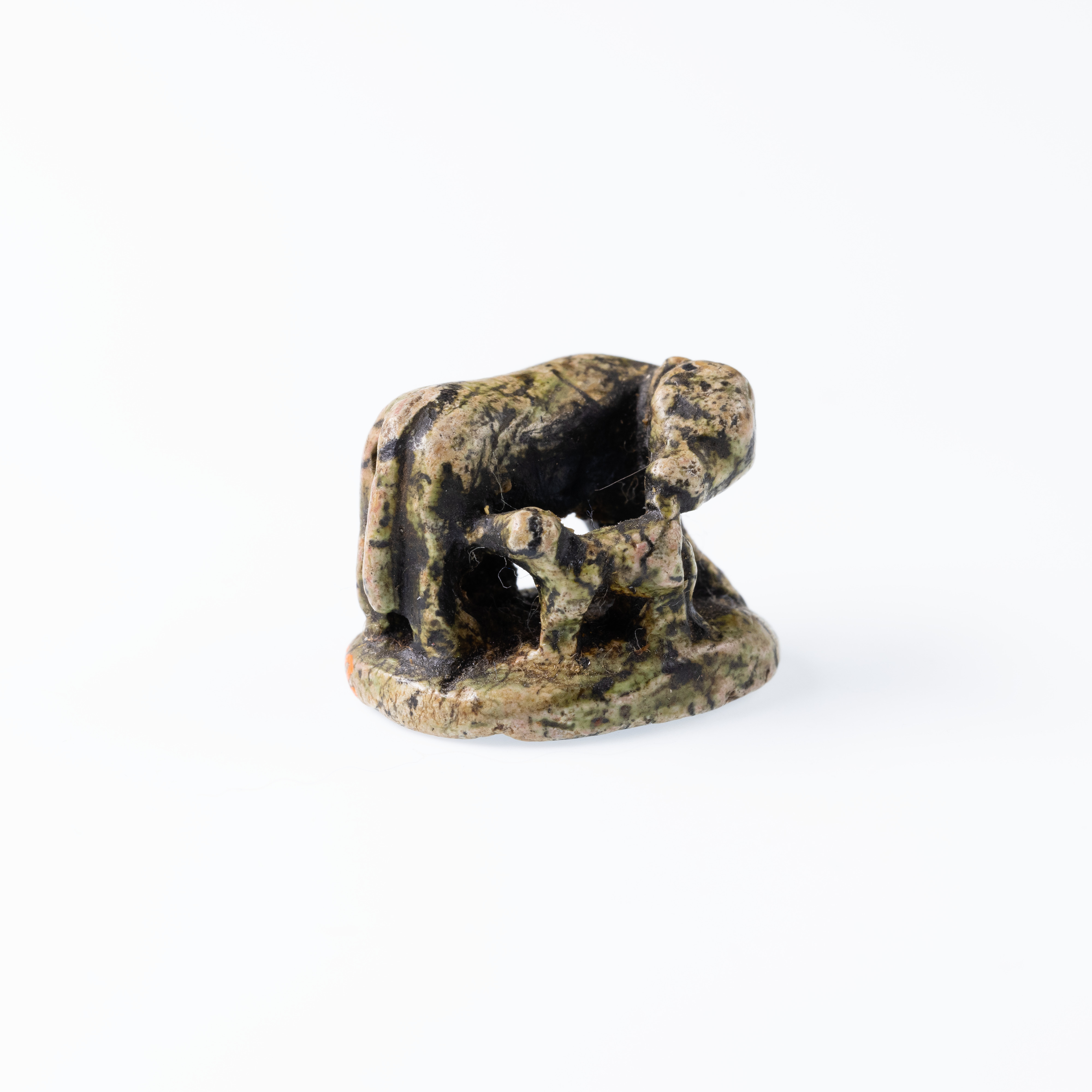 Design Amulet, Cow Nursing Calf and also a Kneeling Suckling Man Visible on Opposite Side on the Back, Device showing Antithetical Falcons with an Ankh Sign over a Lion