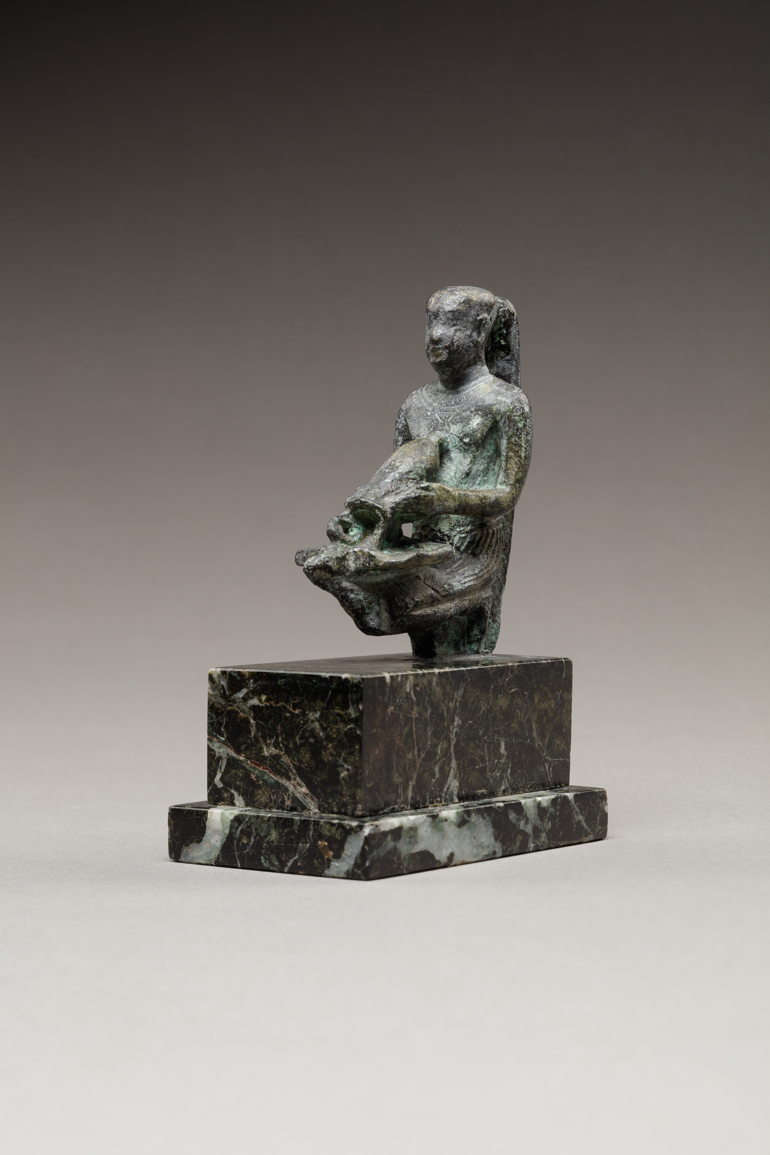 Pediese kneeling and pouring libation