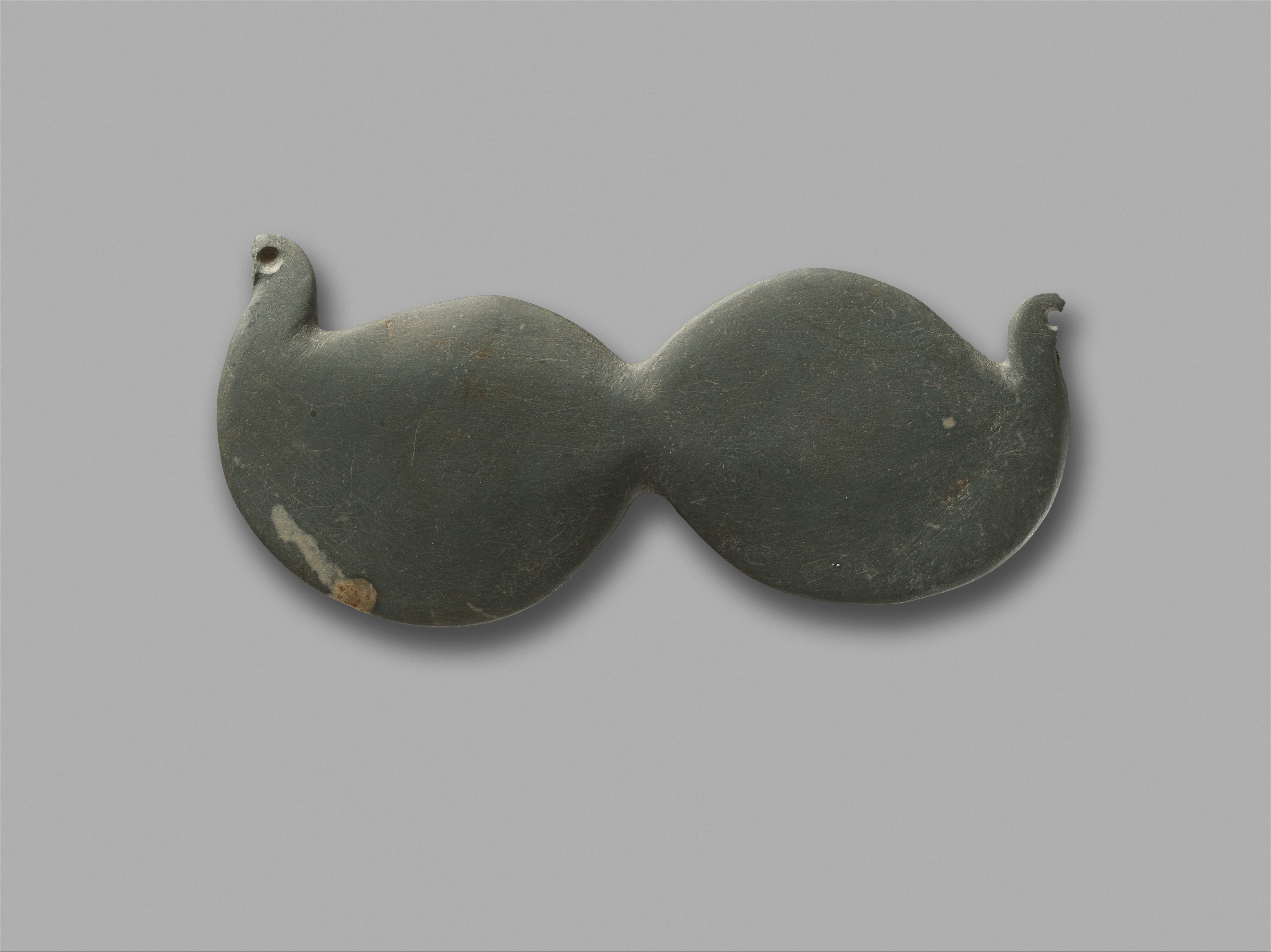 Palette with two birds attached at their tails