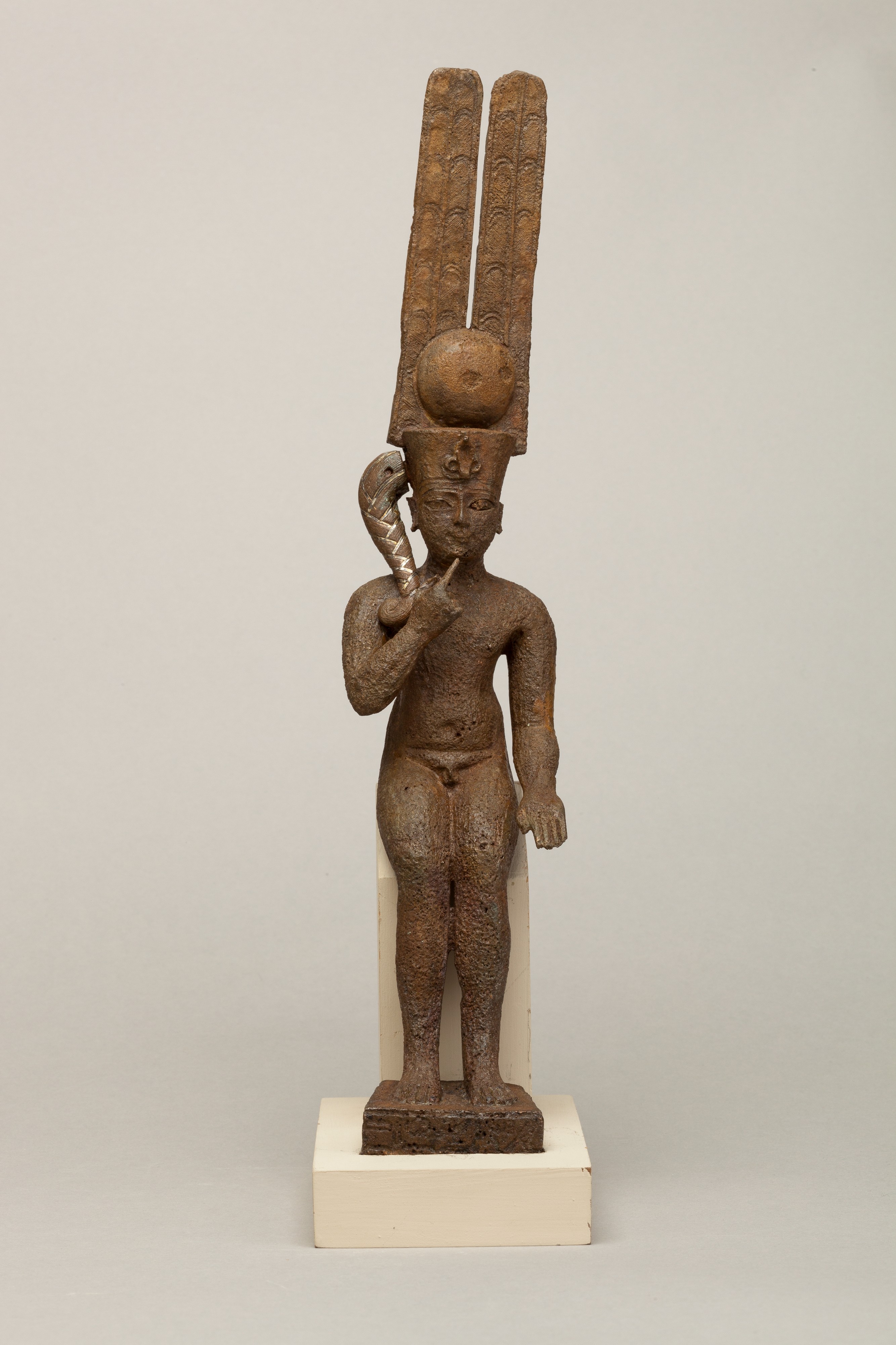 Seated Harpokrates with the crown of Amun, named as "Harpokrates-the-great, the eldest, the first of Amun"
