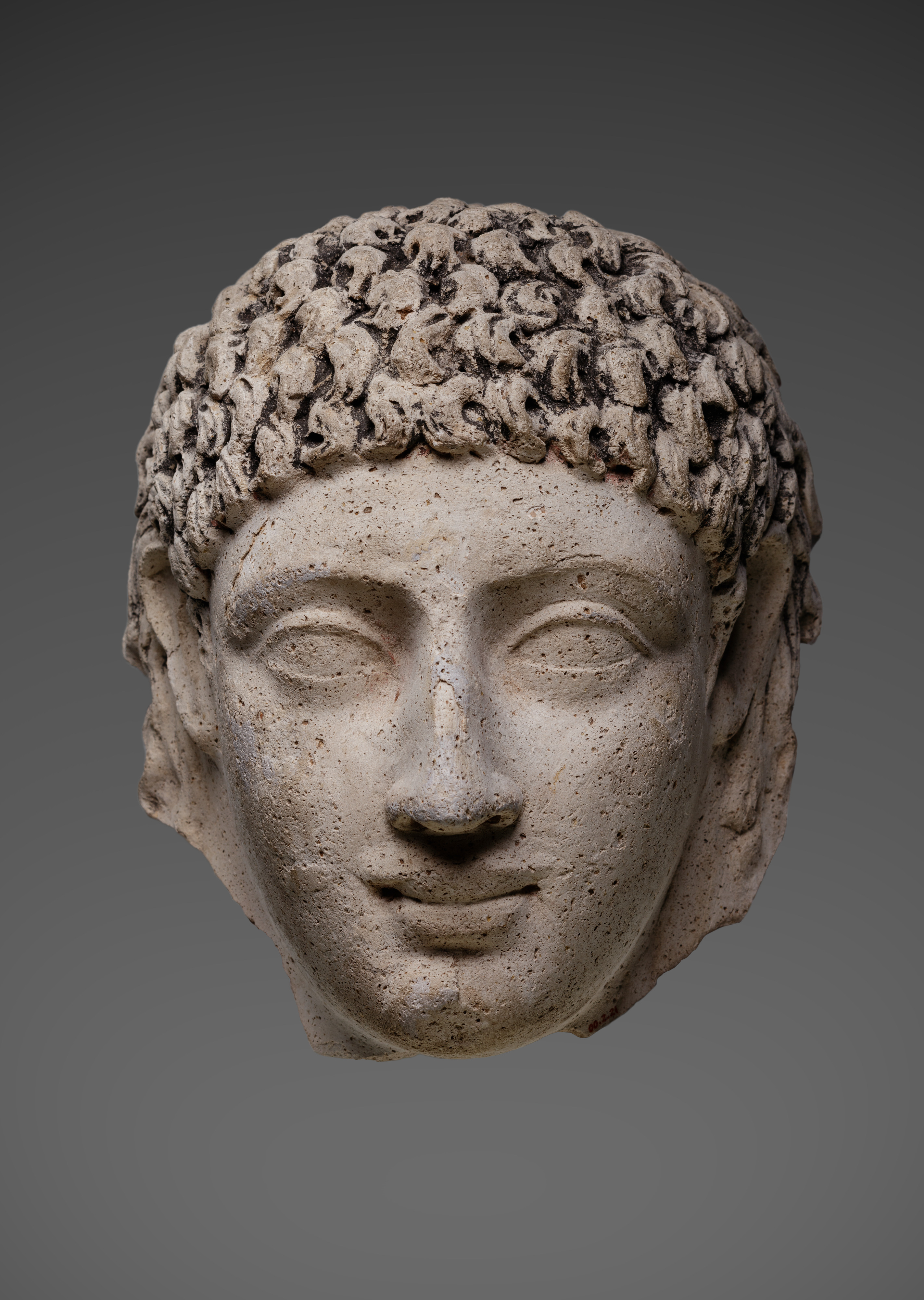 Mask of a young person with an unusual hairstyle