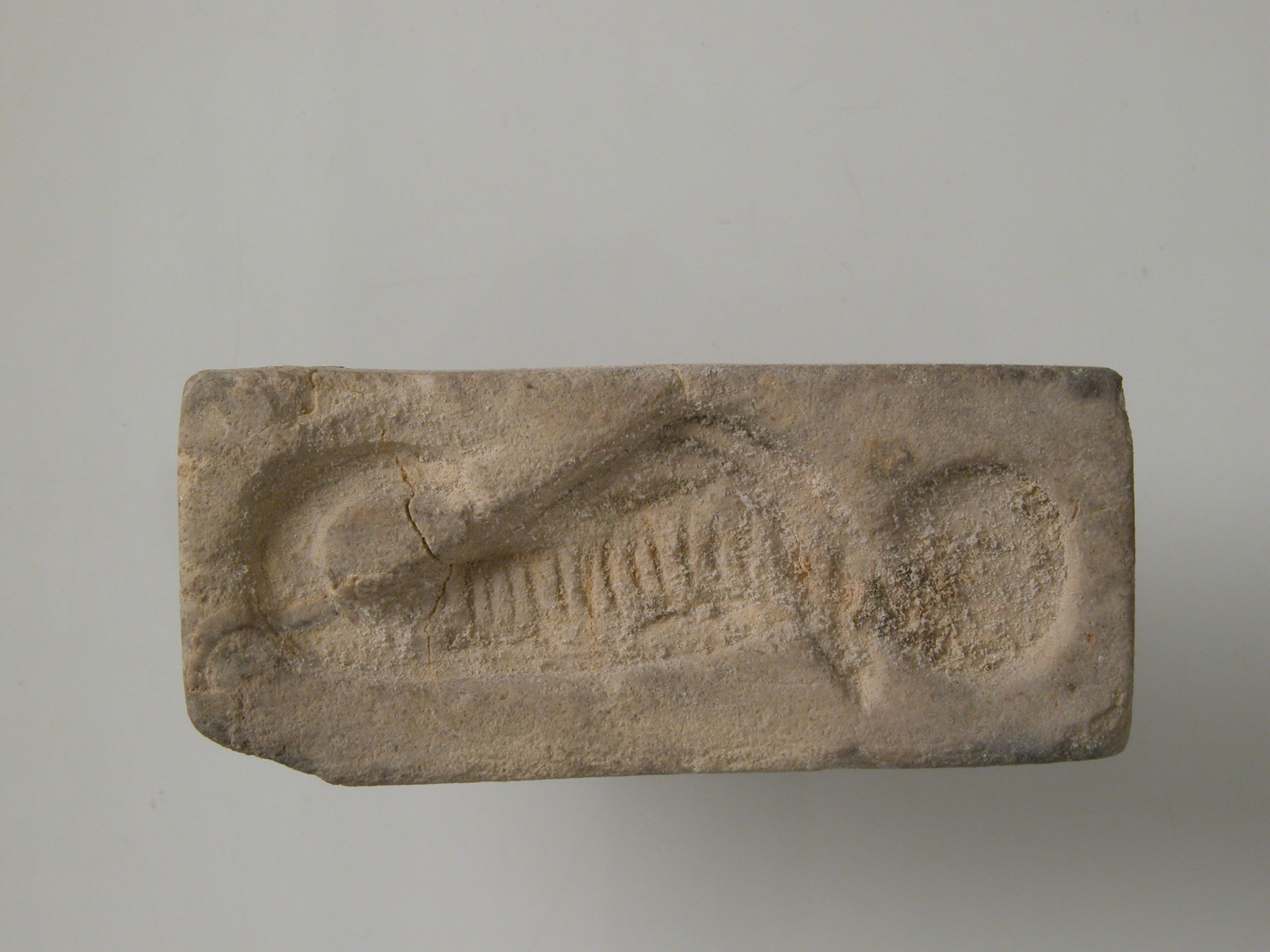 Stamp with uraeus and sun disk