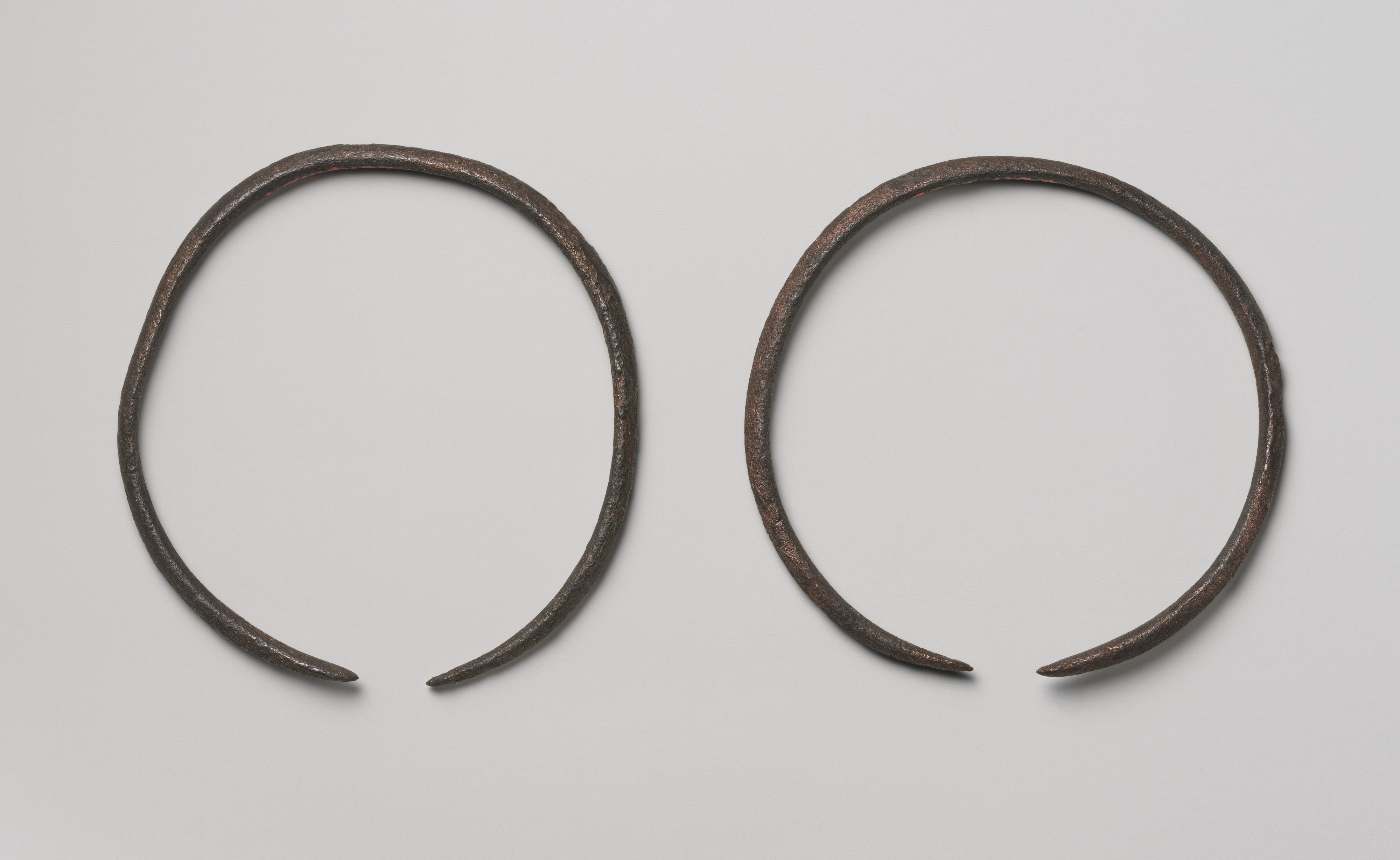A pair of bracelets or anklets