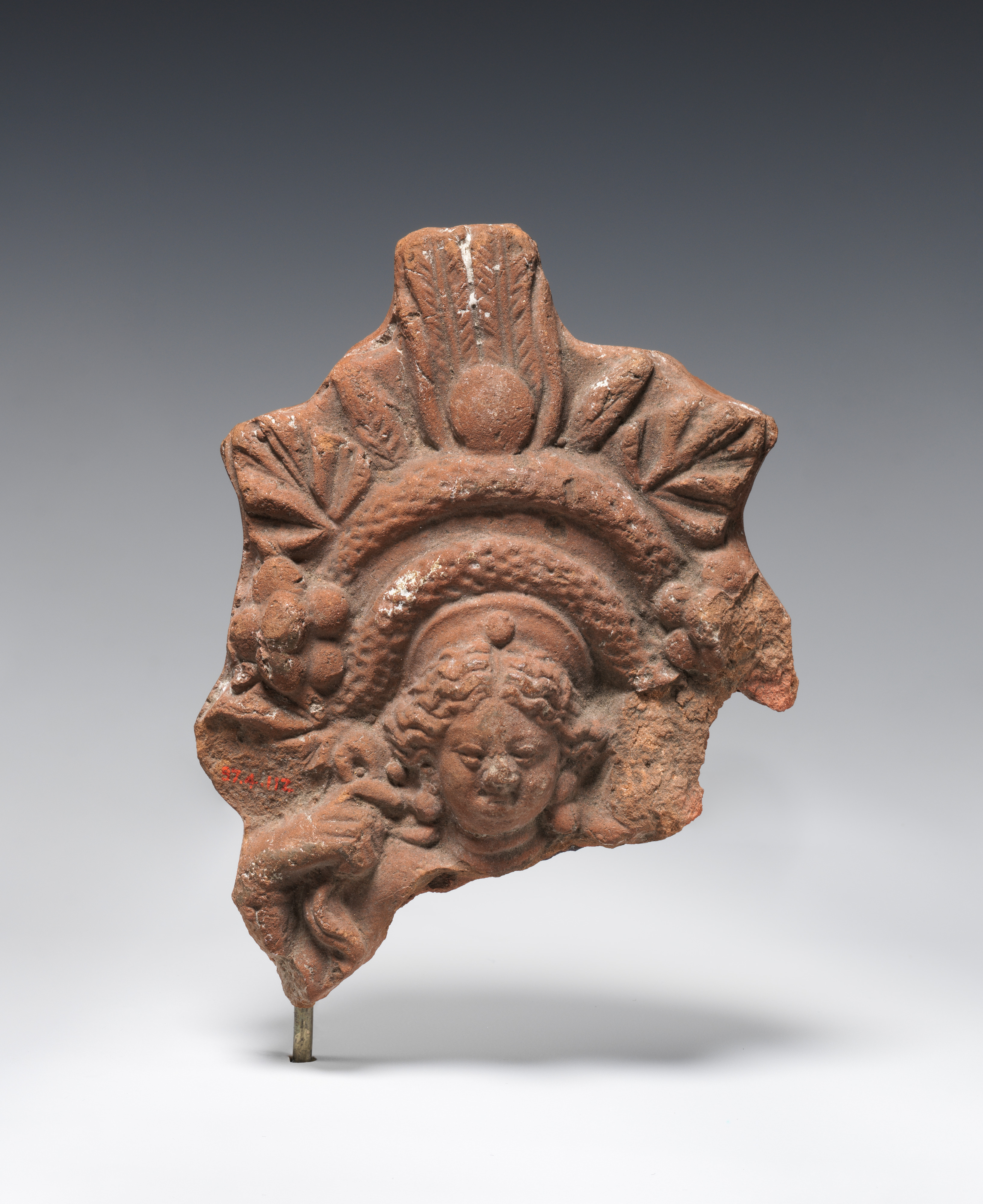 Figurine with elaborate headdress