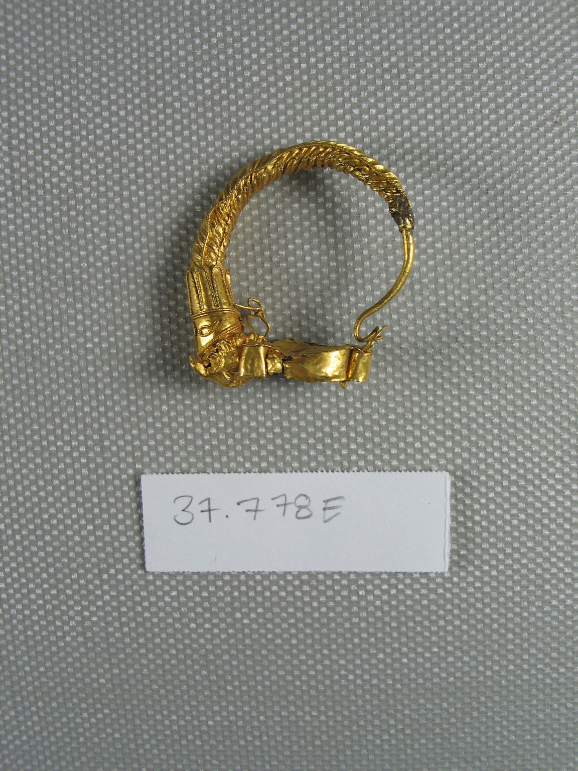 Broken Earring with Calf's Head?