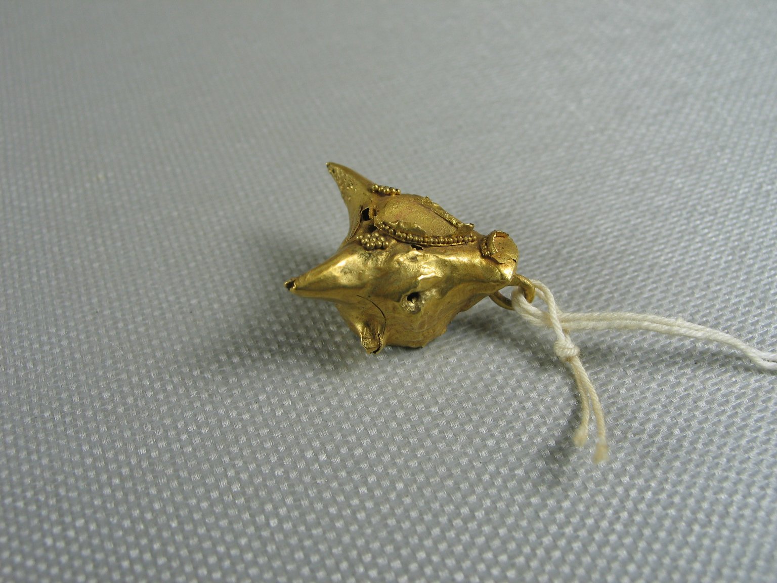 Fragments of a Large Earring with Bull's Head