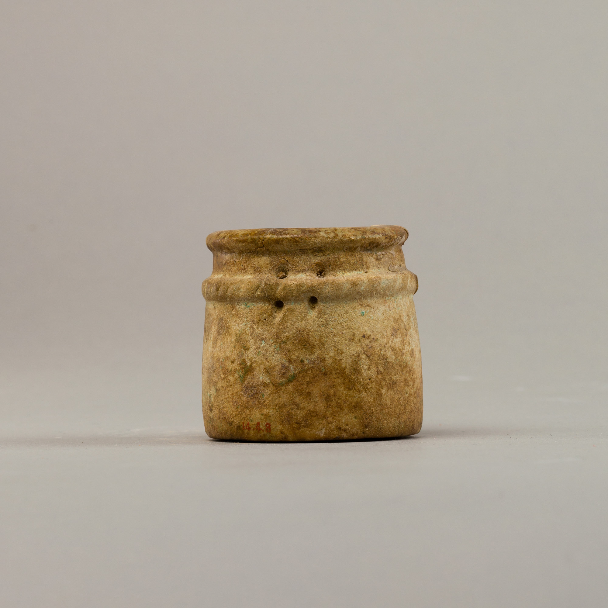Small cylindrical jar with raised rope band