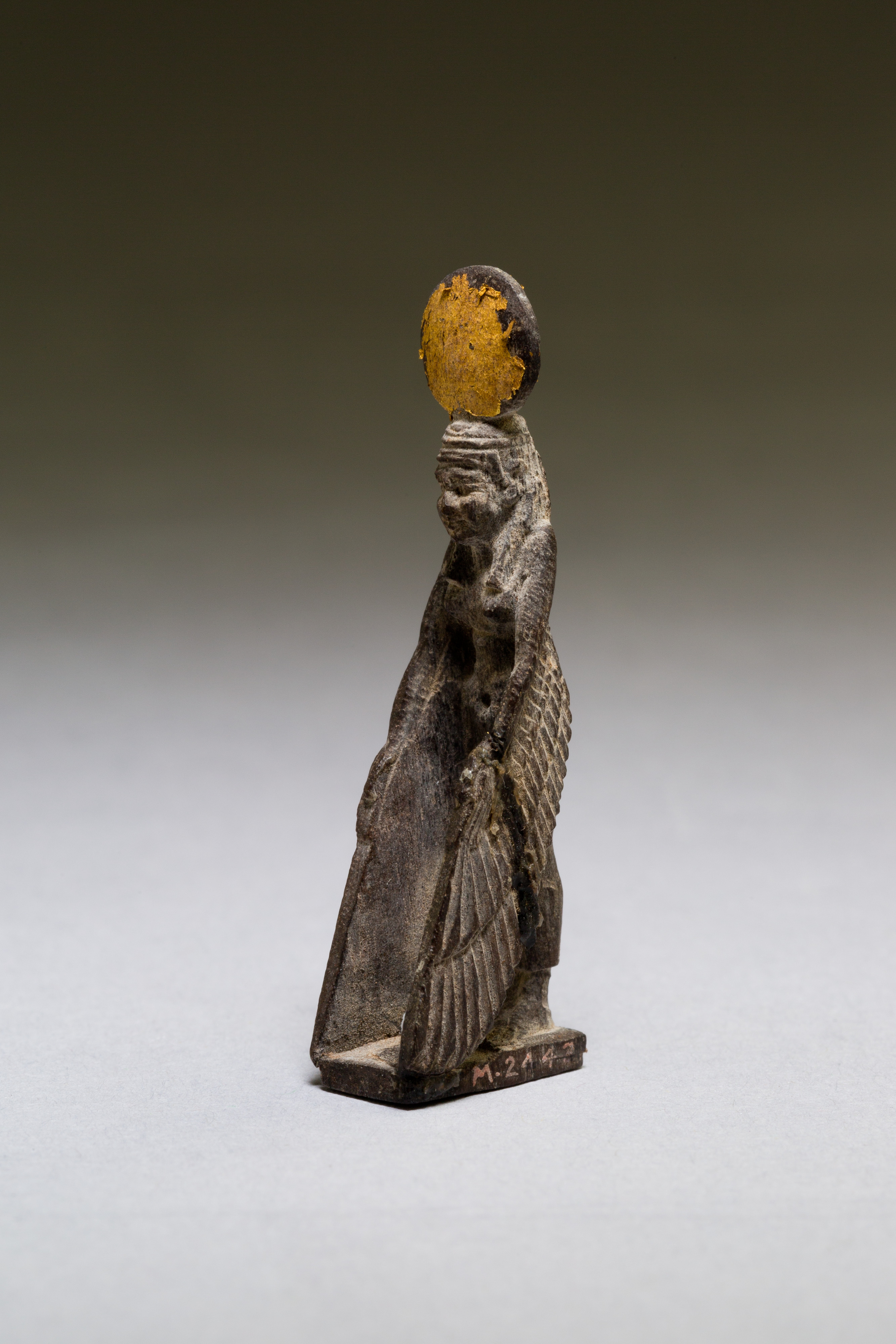 Goddess with gilded sundisk and wings