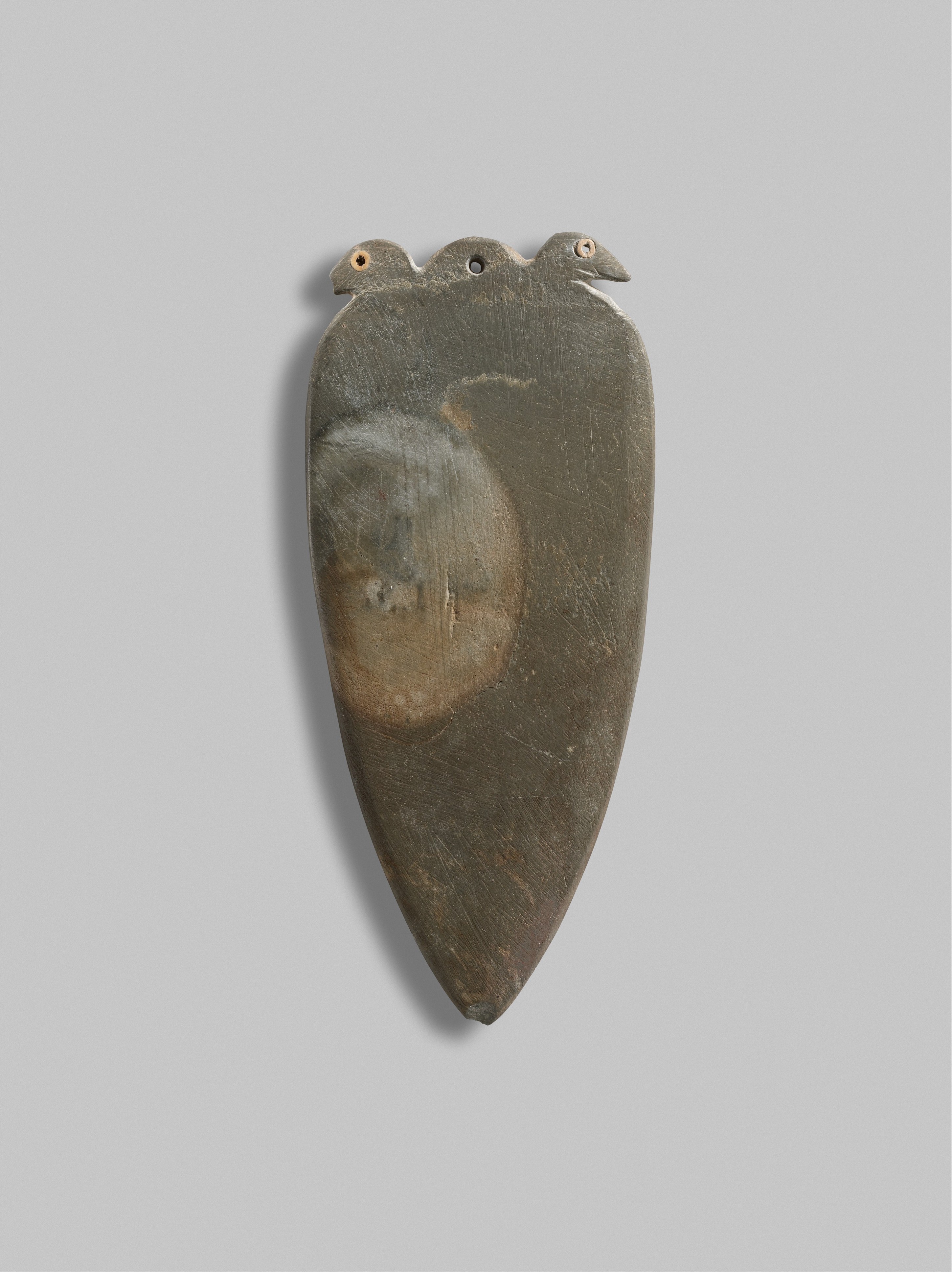 Palette with double bird heads with inlaid eyes