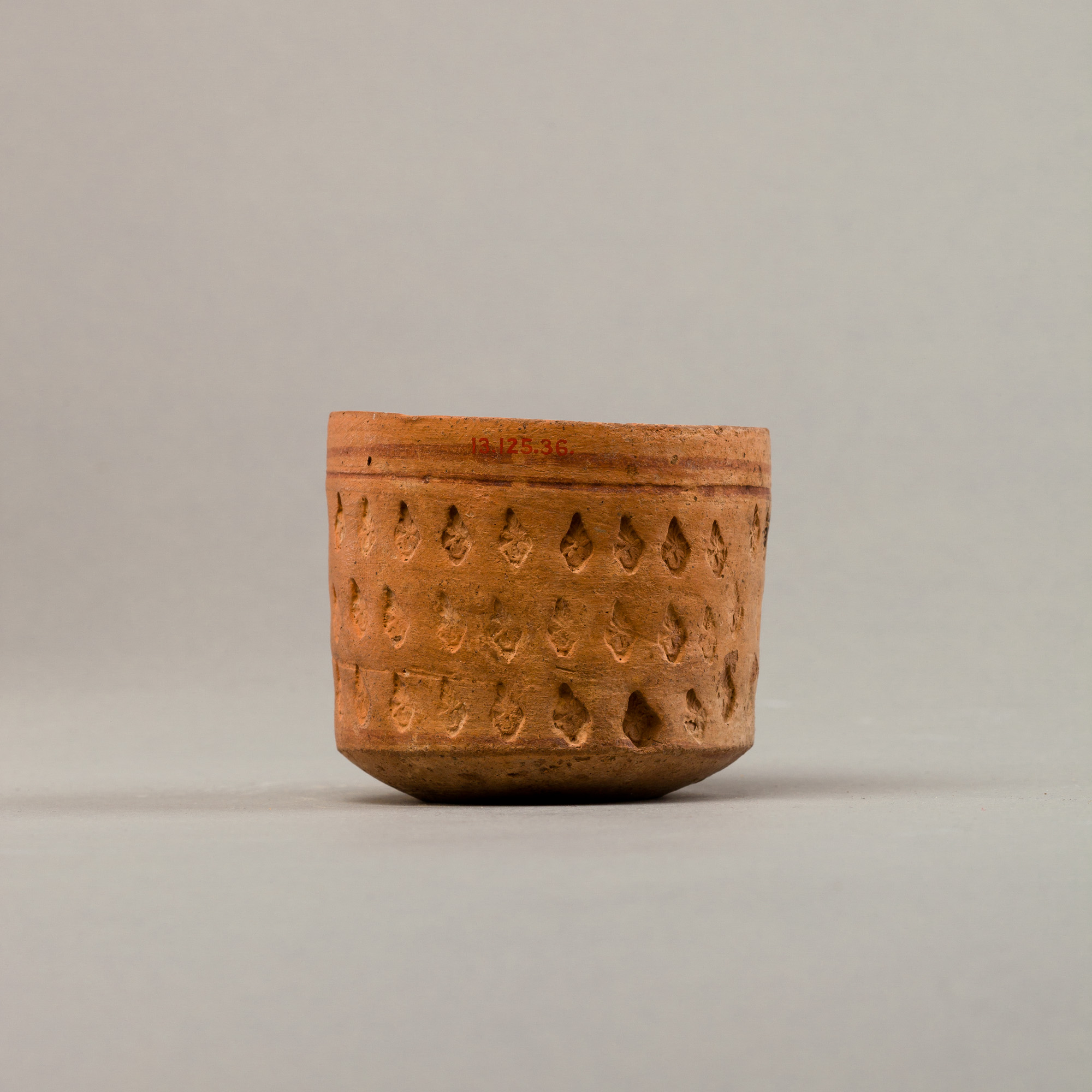 Cup with three rows of impressed decoration