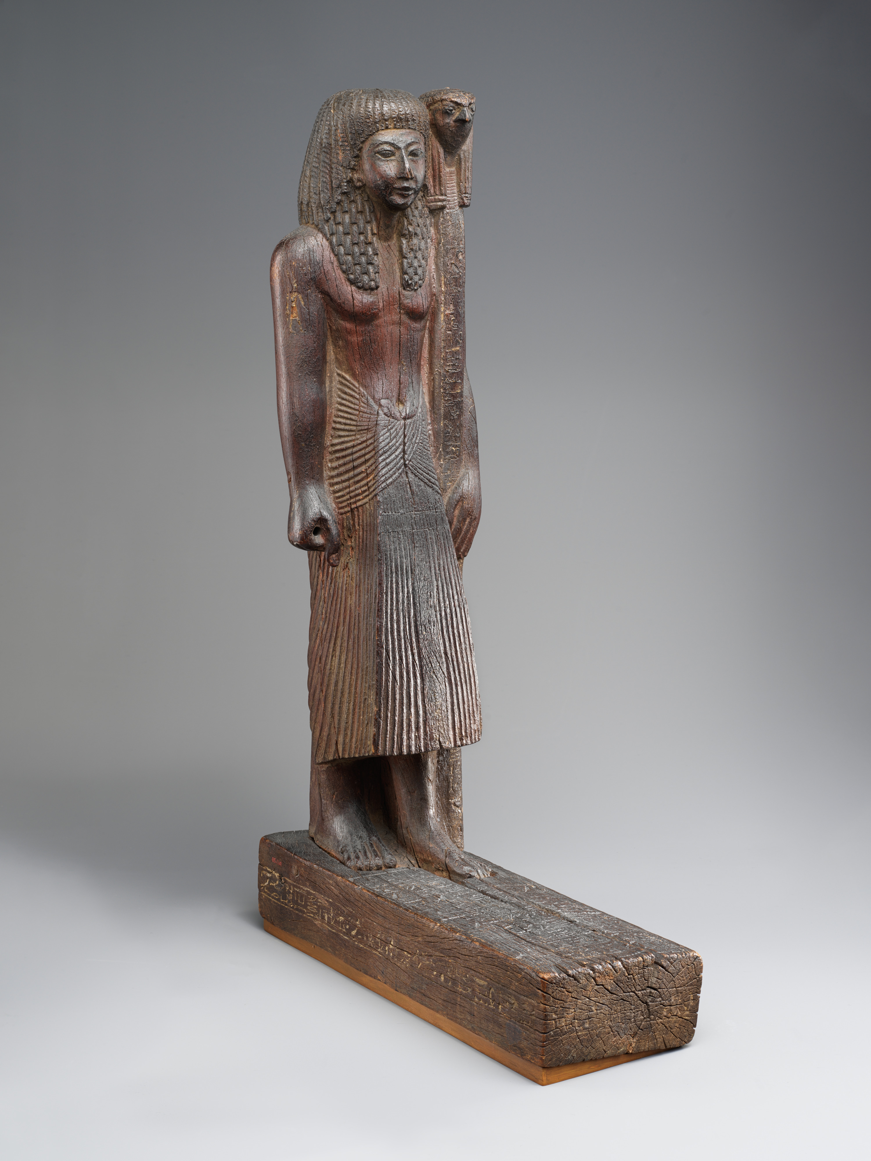 Statuette of Kary carrying a standard of Horus