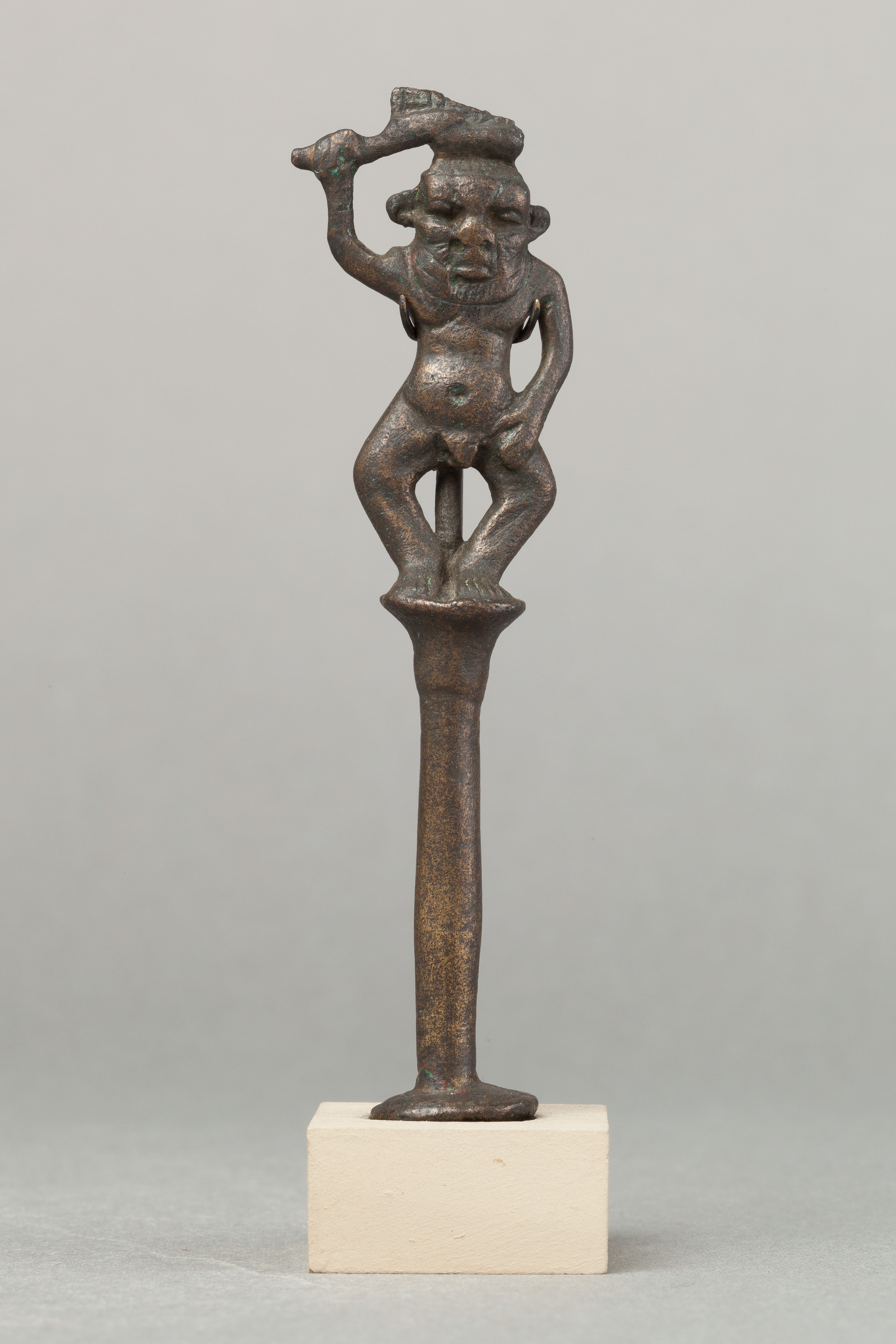Bes on a column holding a knife