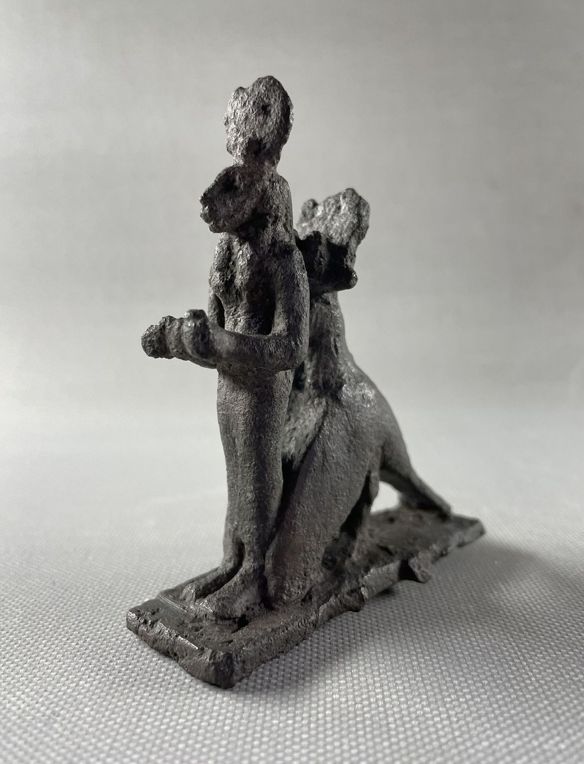 Group of the Goddess Sekhmet Standing Surmounted by the Sun Disk within the Embrace of a Jackal - Headed Bird