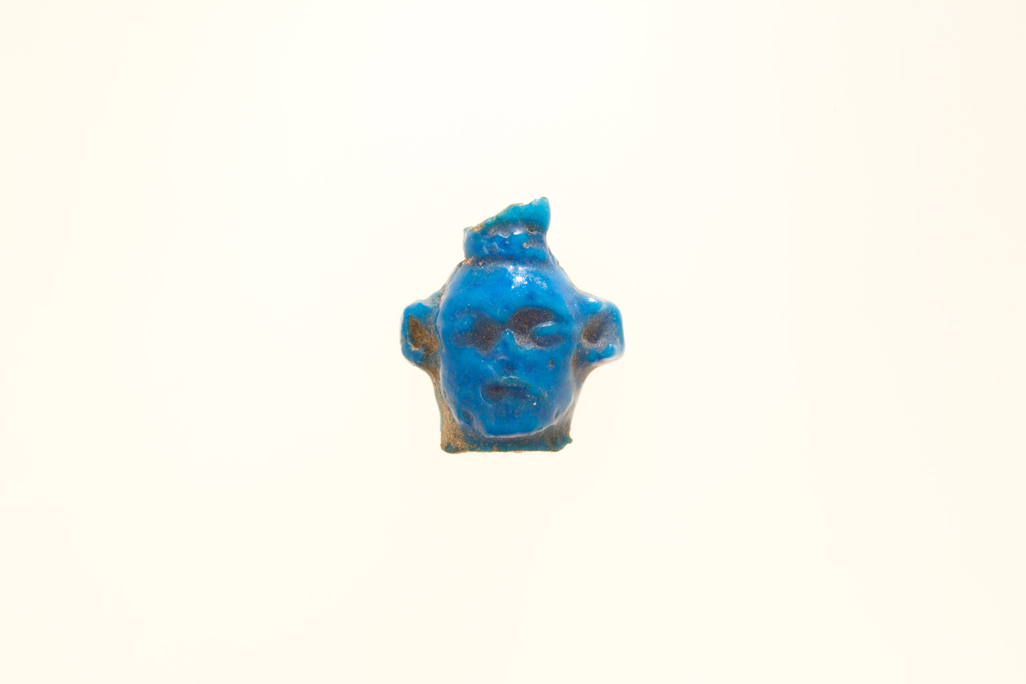 Amulet, head fragment