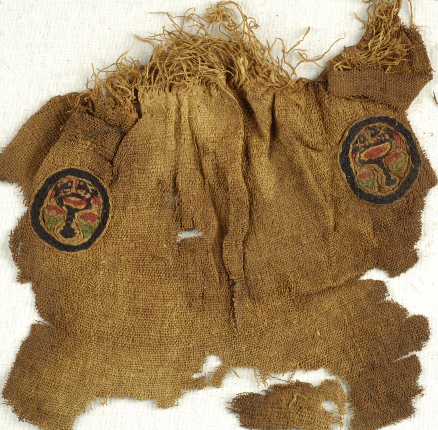 Fragment with 2 Roundels with Botanical and Animal Decoration